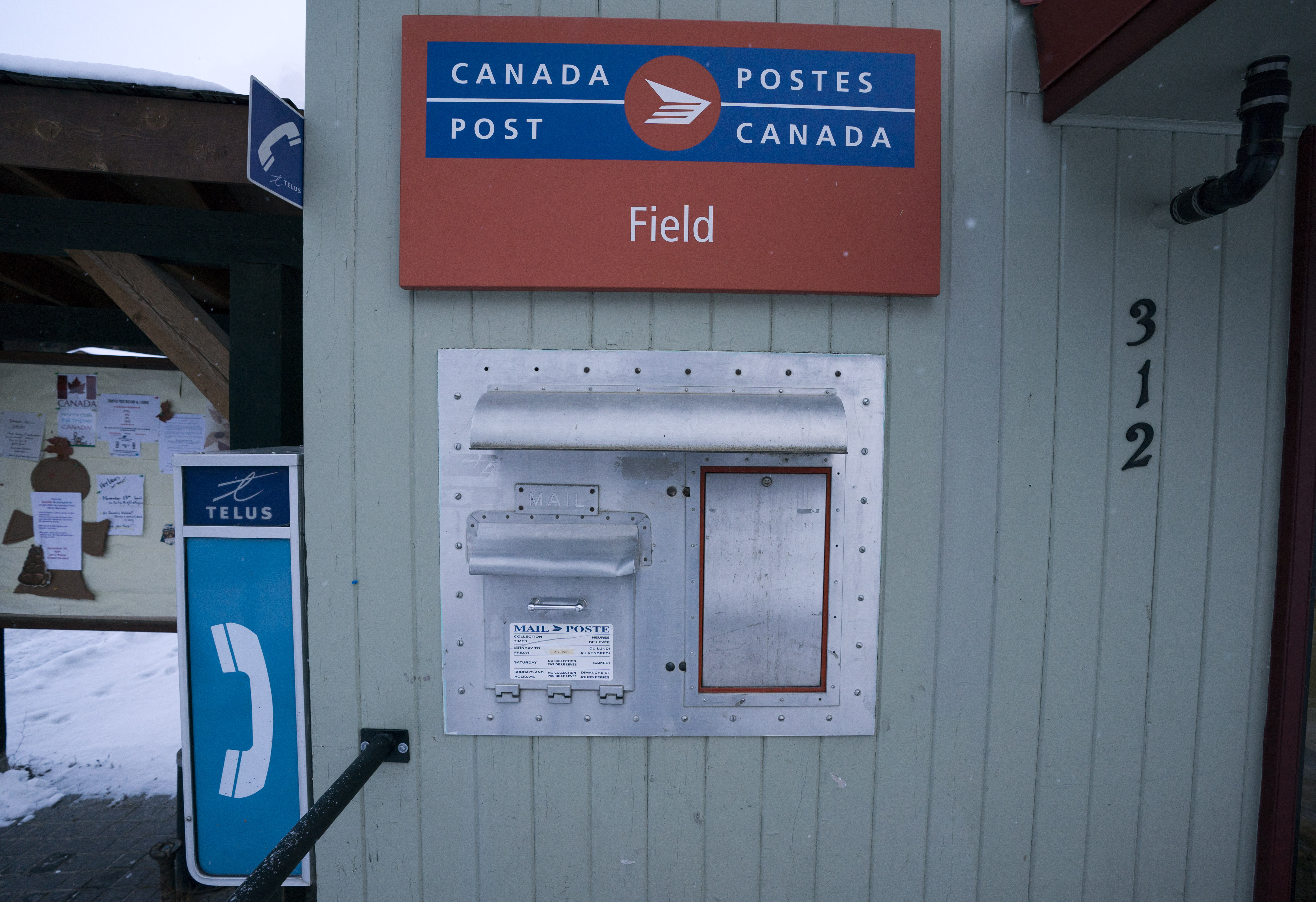 A mailbox is mounted on the front of the Field Post Office November 30, 2017 in Field, British Columbia. (Photo by DON EMMERT / AFP)