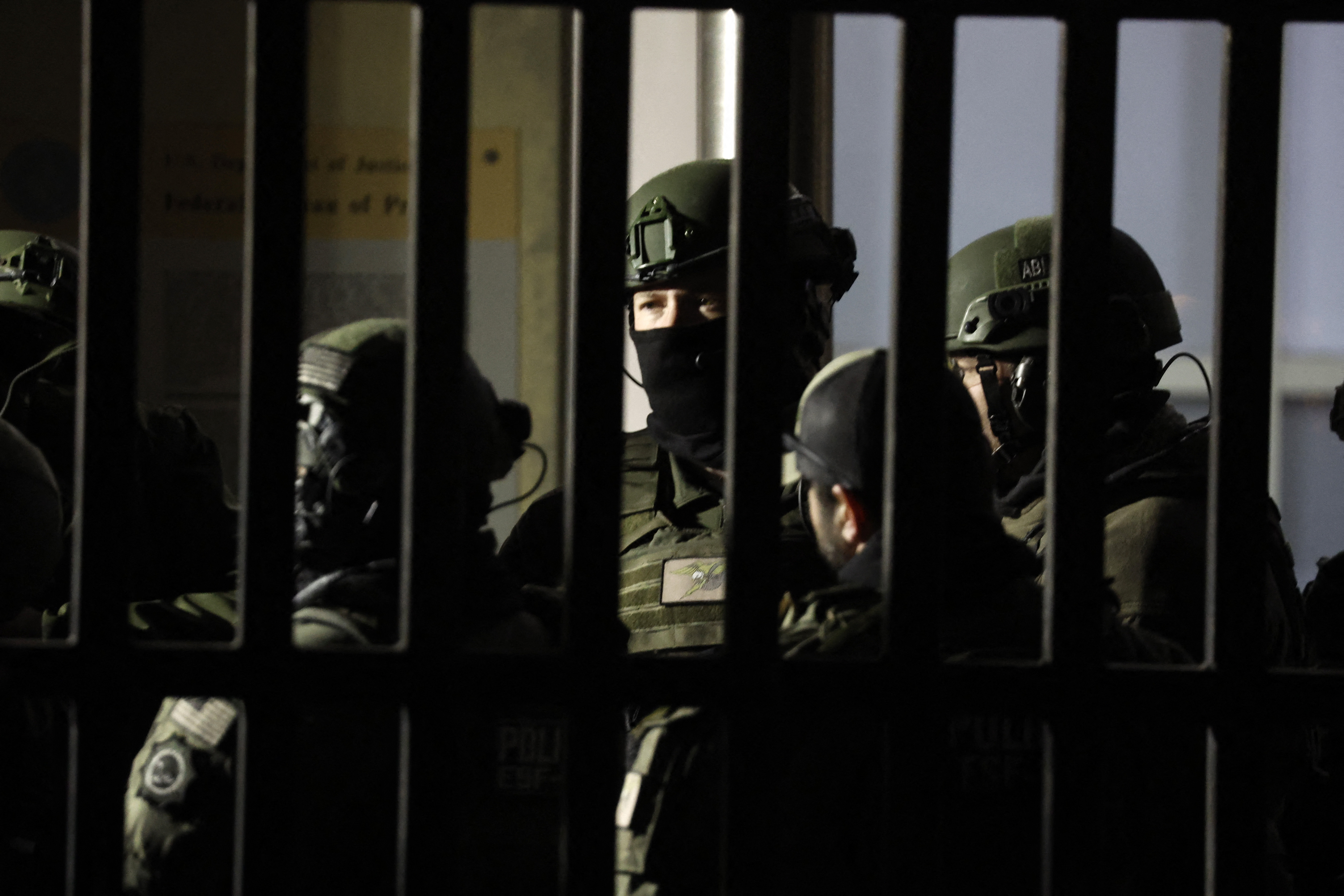 Armed police officers arrive at the Metropolitan Detention facility in the Brooklyn