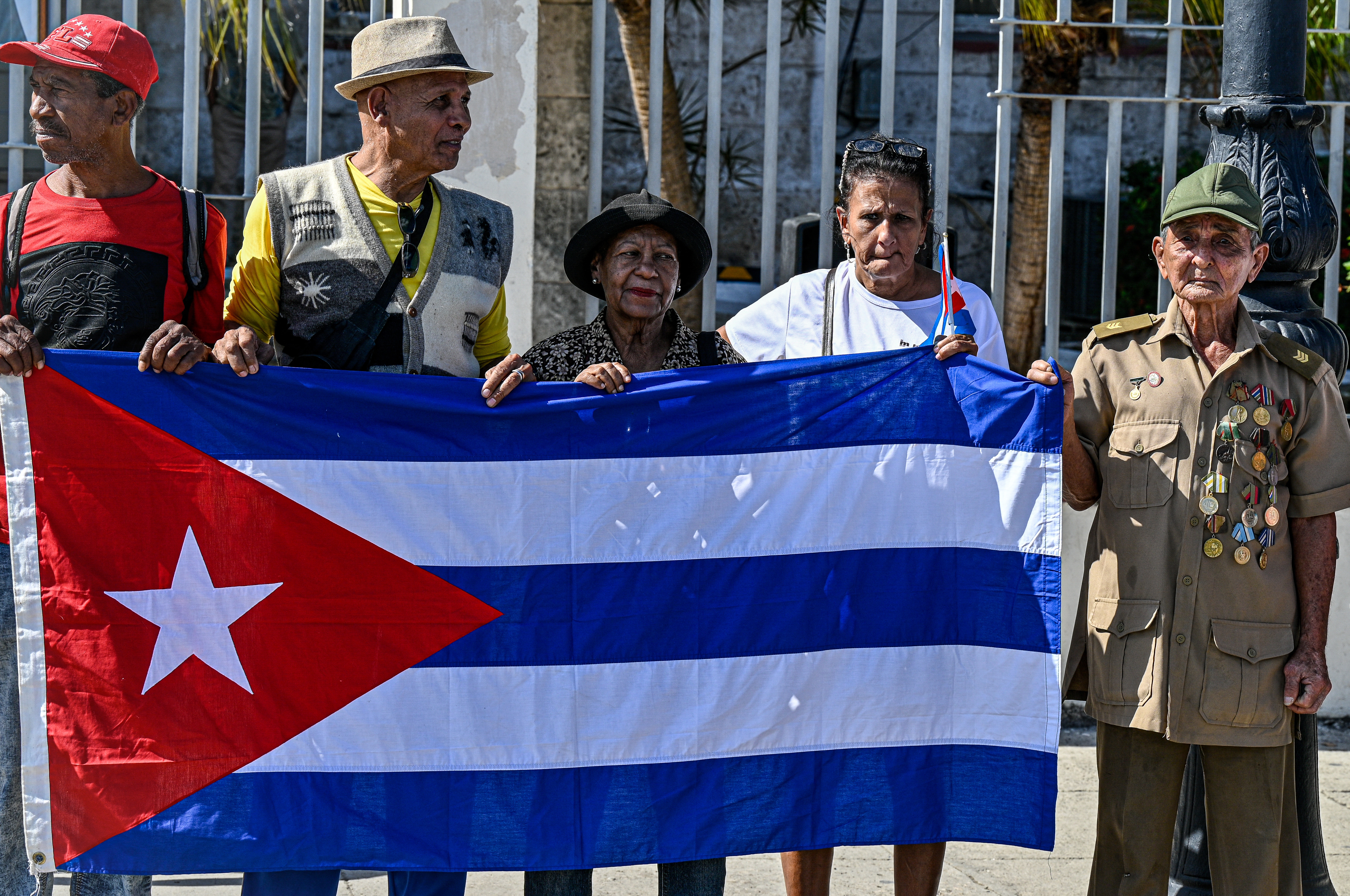 Cubans hold a national flag during the 67th anniversary of the Caravan of Freedom to commemorate Fidel Castro’s historic entry into the city which marked the start of the Cuban Revolution, in Havana on January 8, 2026. (Photo by )