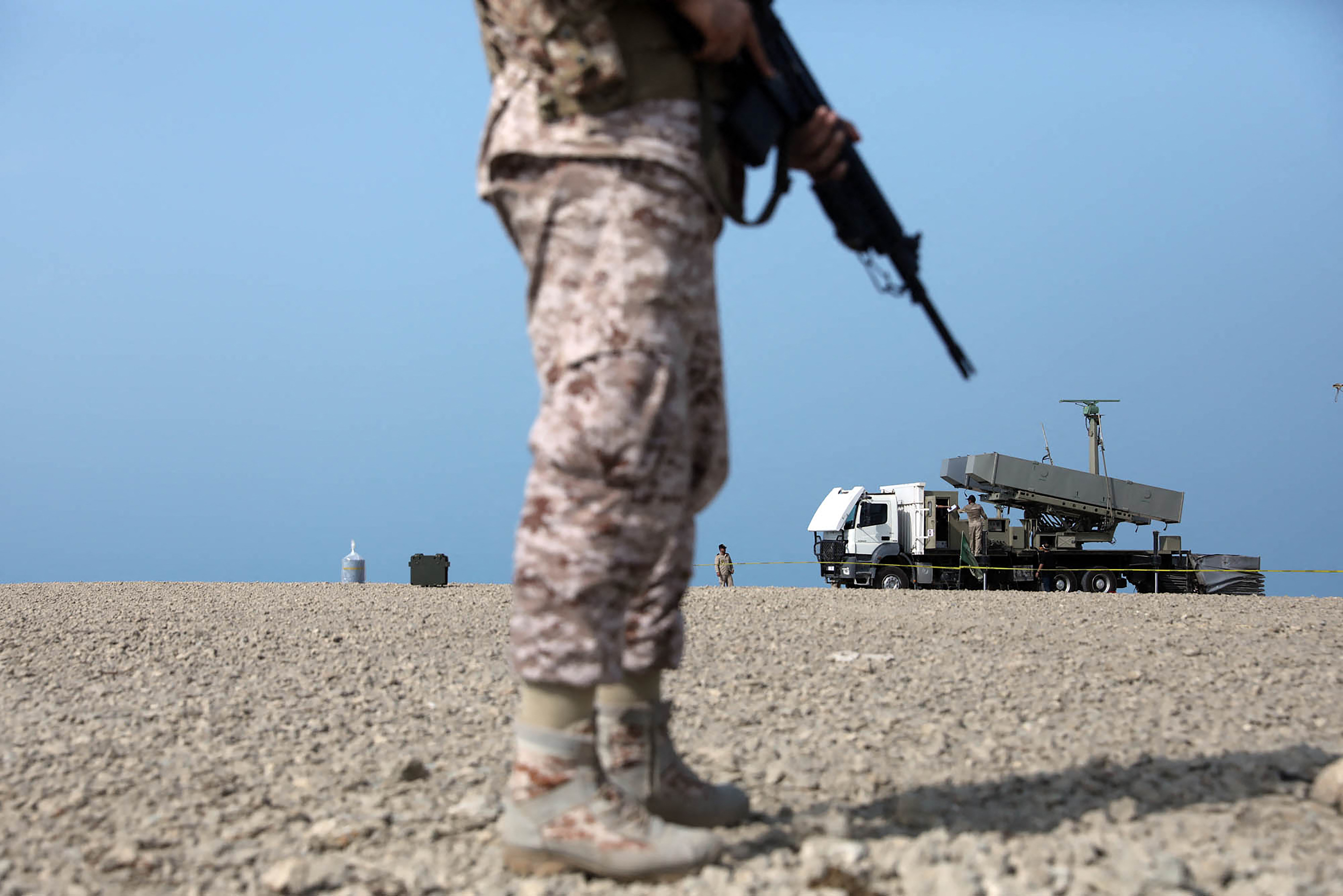 A handout picture provided by the Iranian Army office on August 21, 2025, shows a a soldier standing near a rocket launcher during a military drill in an undisclosed location in southern Iran.