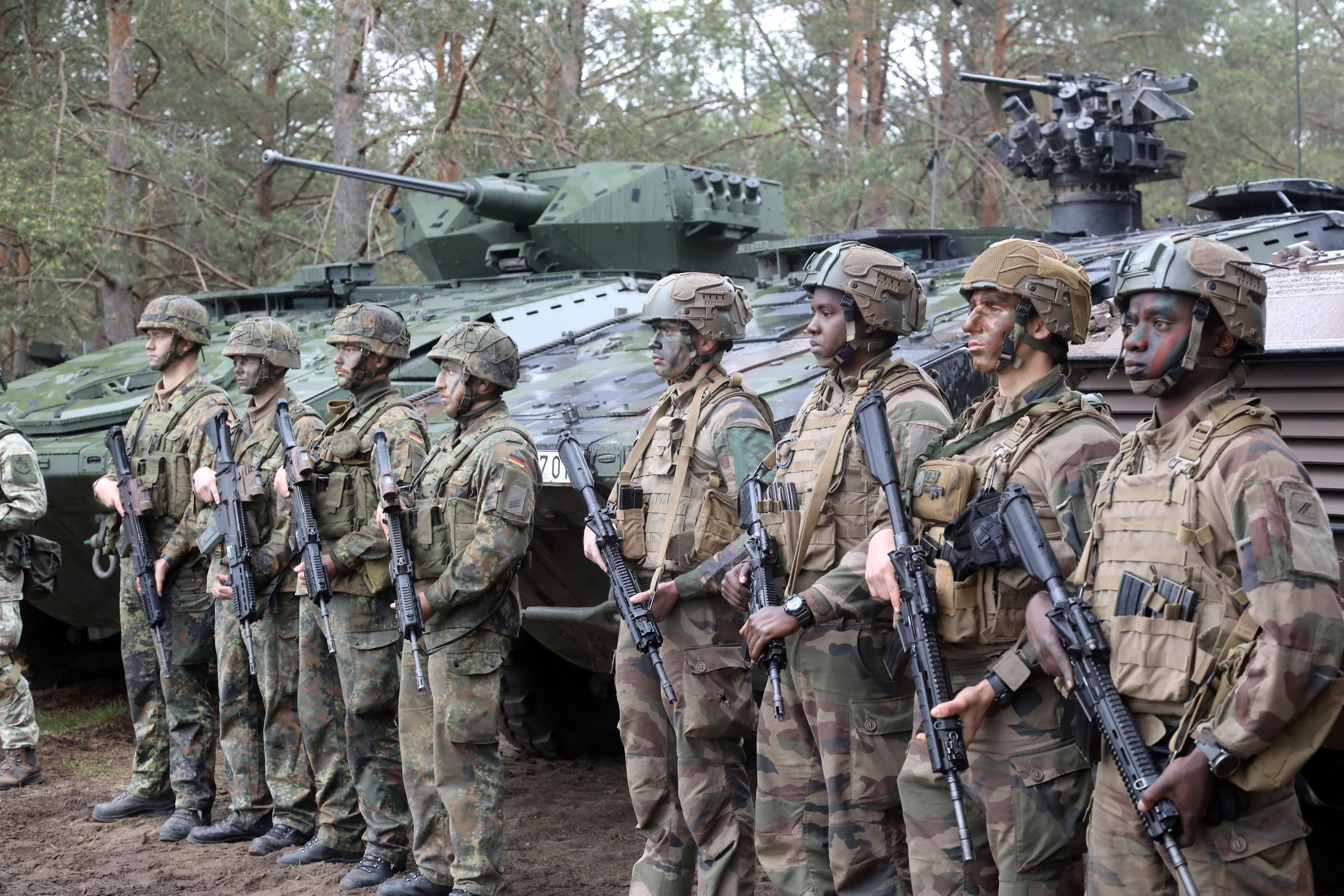Soldiers take part in the combat shooting exercises of the Lithuanian army and the French-German brigade at the General Silvestras Zukauskas Training Area in Pabrade, Lithuania, on May 6, 2024. (Photo by PETRAS MALUKAS / AFP)