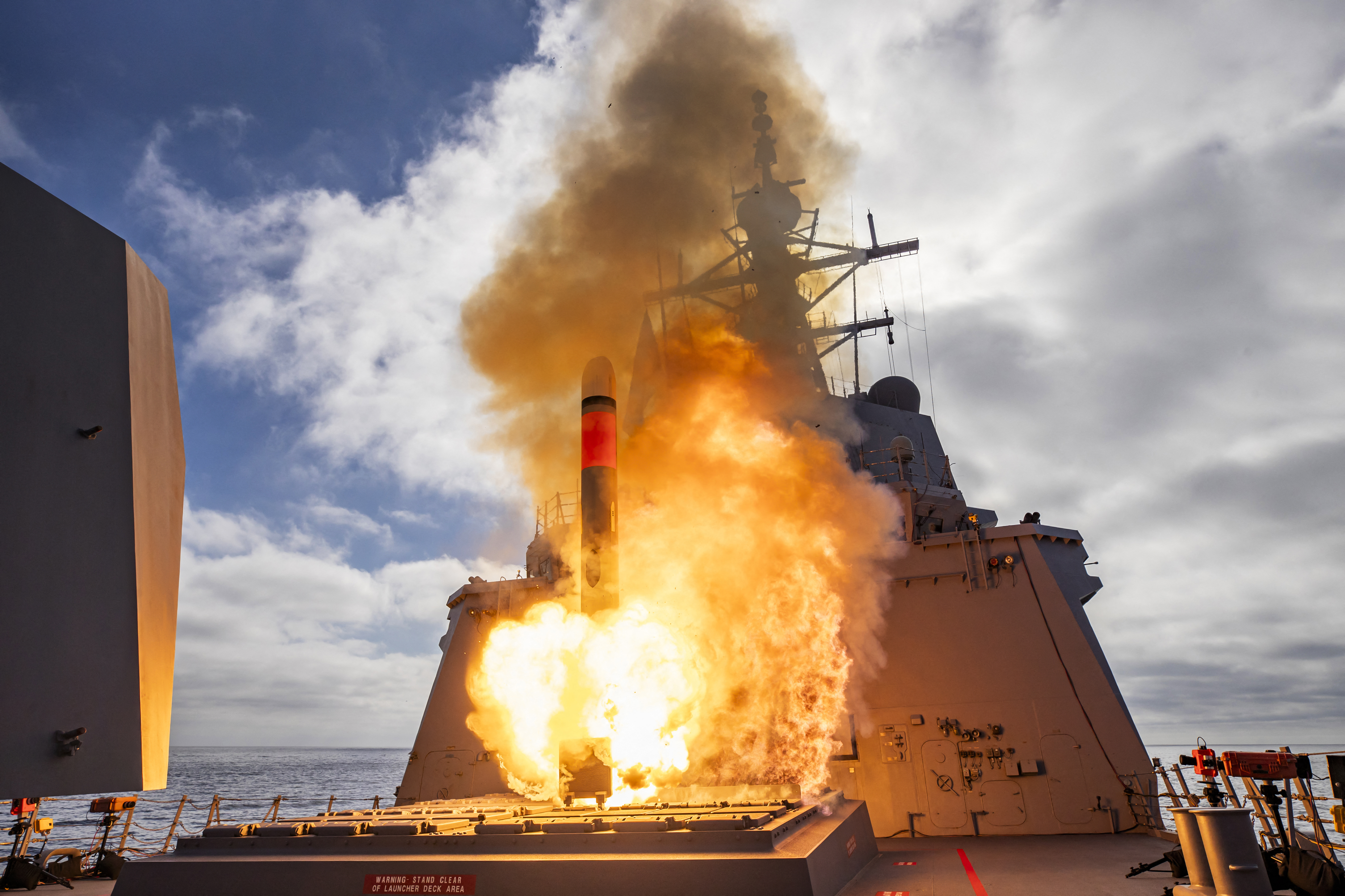 An undated handout photo received on December 10, 2024 from the Australian Defence shows the HMAS Brisbane firing a Tomahawk Weapon System off the west coast of the US.