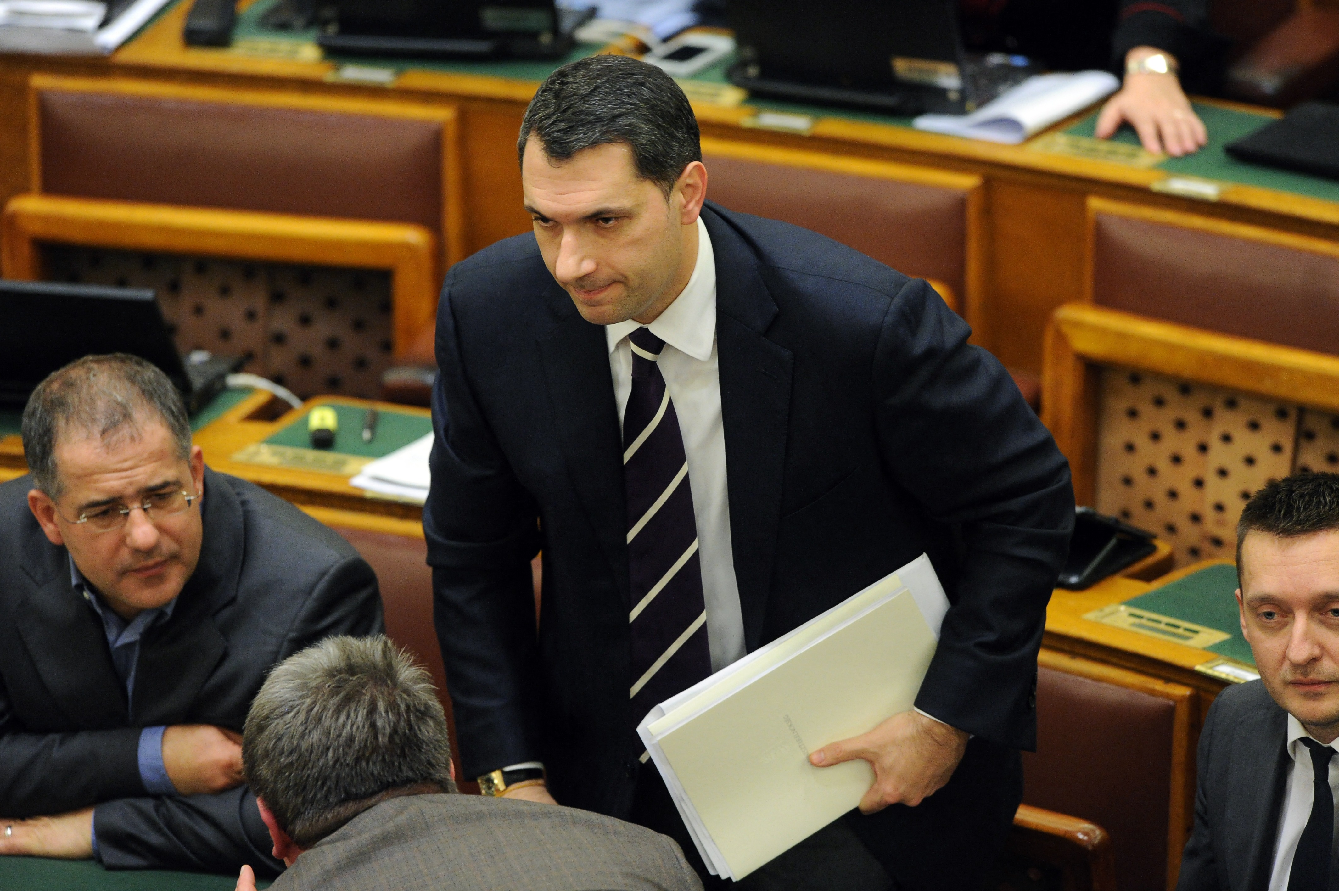 Representative of governor FIDESZ party, leader of the prime minister office, state-secretary Janos Lazar (C) gives his vote in the main hall of the parliament building in Budapest