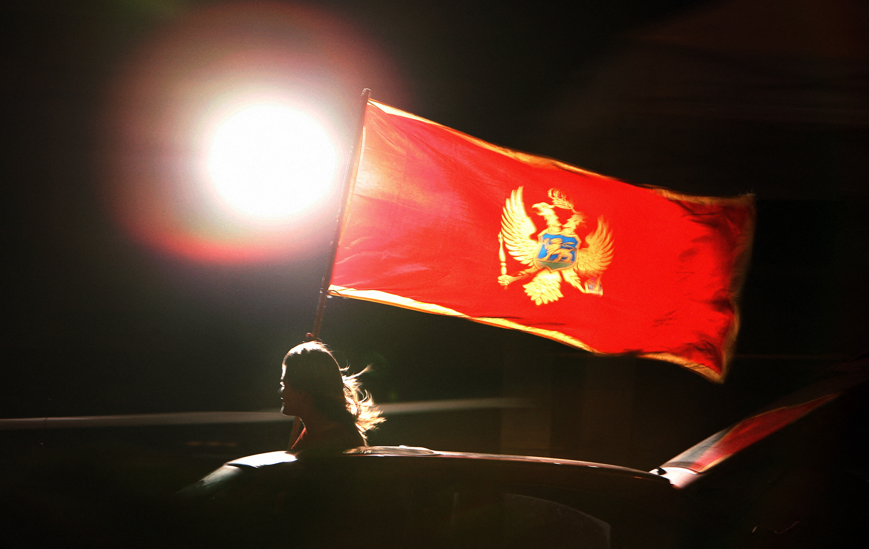 A supporter of Montenegrin independence waves Montenegrin flag.    AFP PHOTO / DIMITAR DILKOFF (Photo by Dimitar DILKOFF / AFP)