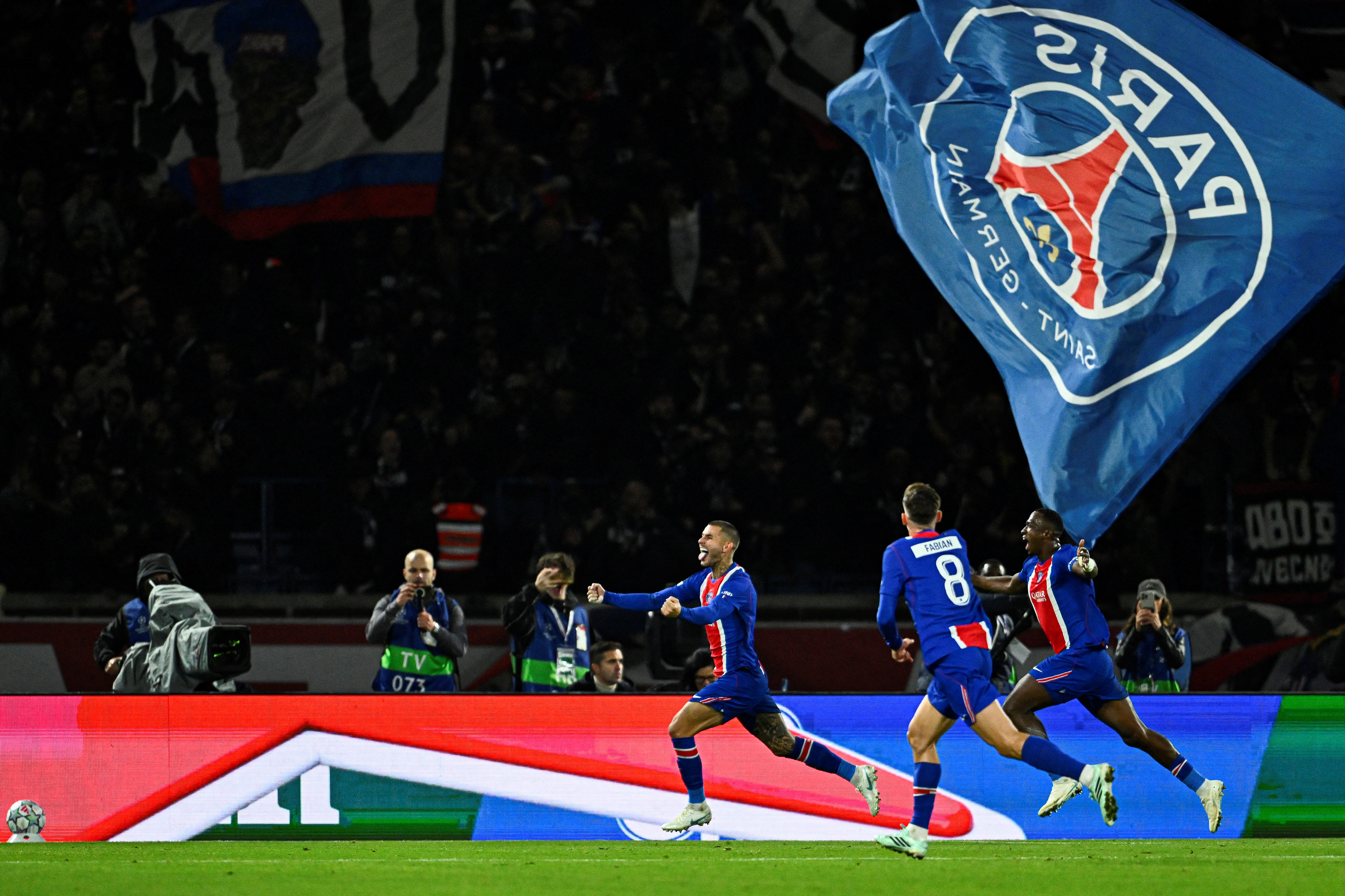 PSG's French defender #21 Lucas Hernandez (L) celebrates after scoring his team's second goal during the UEFA Champions League first round day 3 football match between PSG AND BARCA (Photo by JULIEN DE ROSA / AFP)