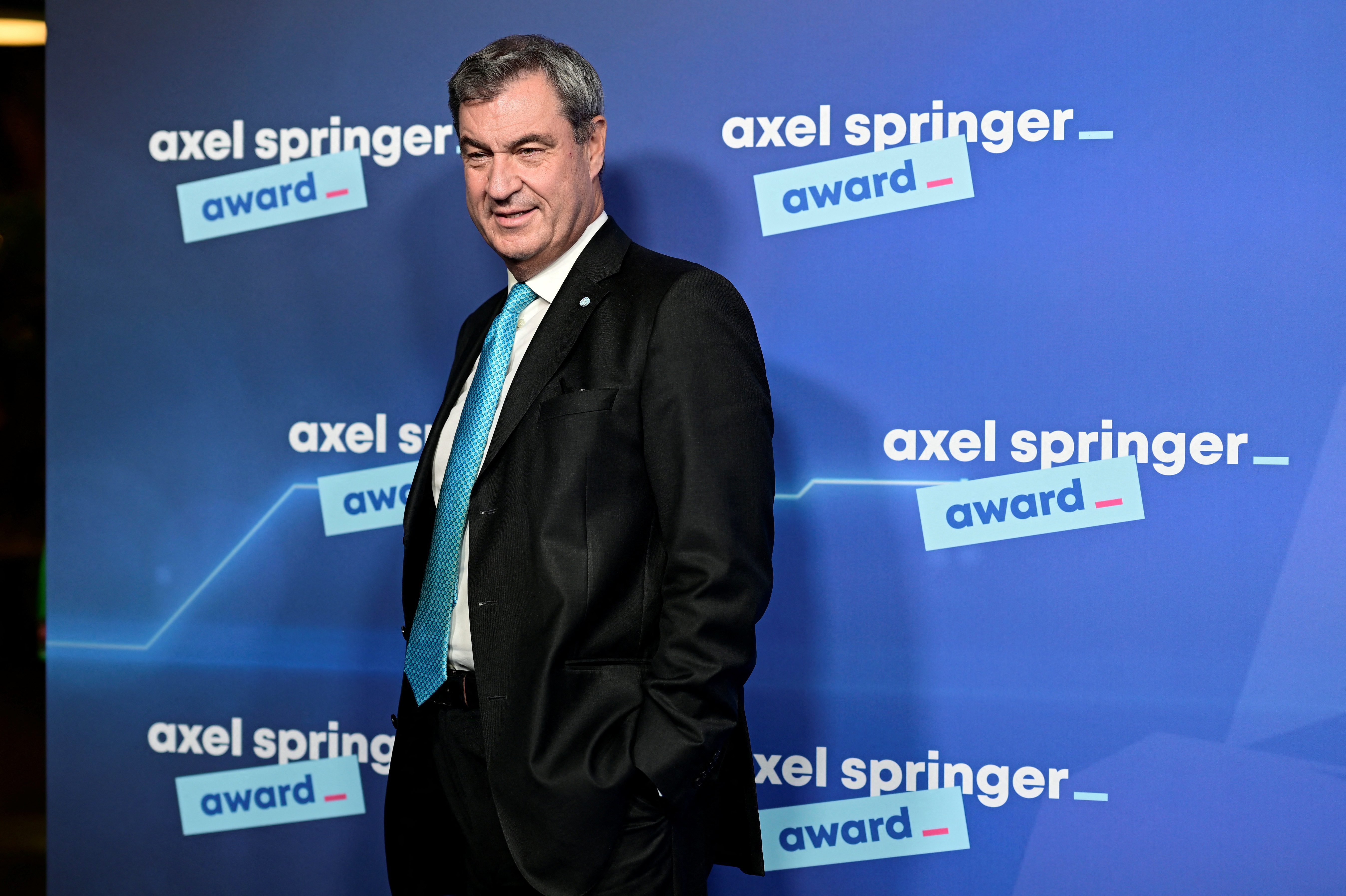 Bavaria's State Premier and leader of the conservative Christian Social Union (CSU) Markus Soeder arrives on the red carpet for the Axel Springer Award in Berlin