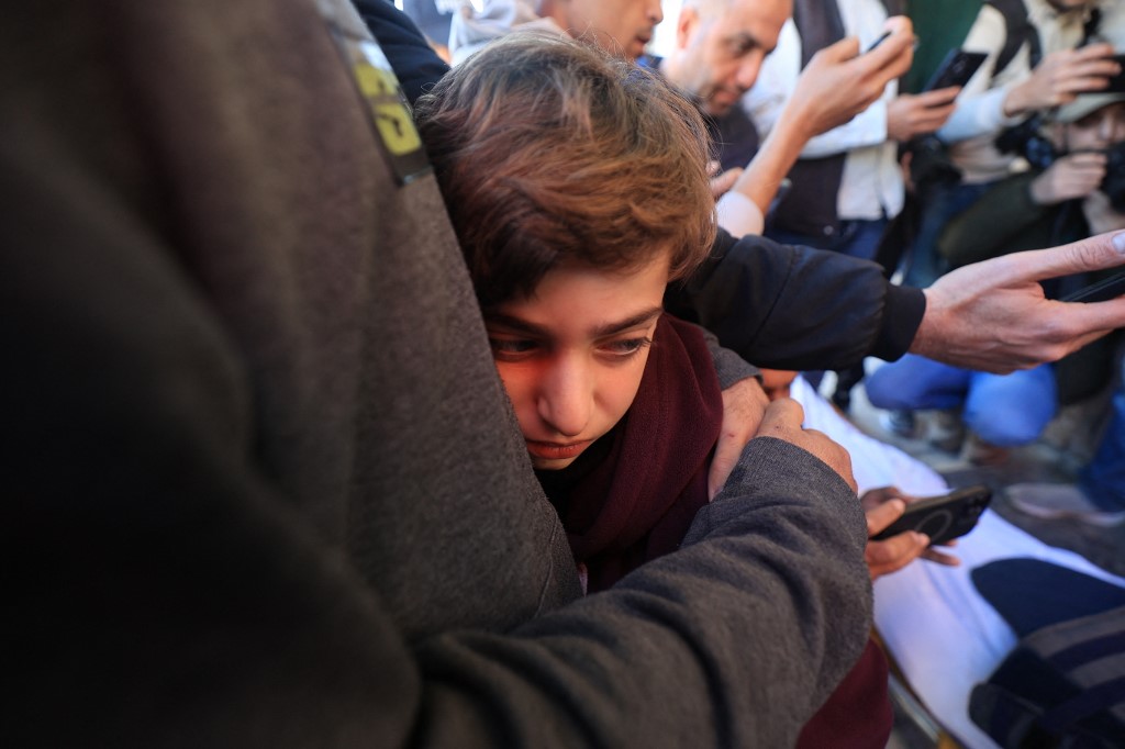 The son of Al Jazeera journalist Mohammad Wishah, who was killed in an Israeli strike, mourns during his funeral at the Al-Aqsa Martyrs Hospital in Deir al-Balah in the central Gaza Strip, on April 9, 2026.