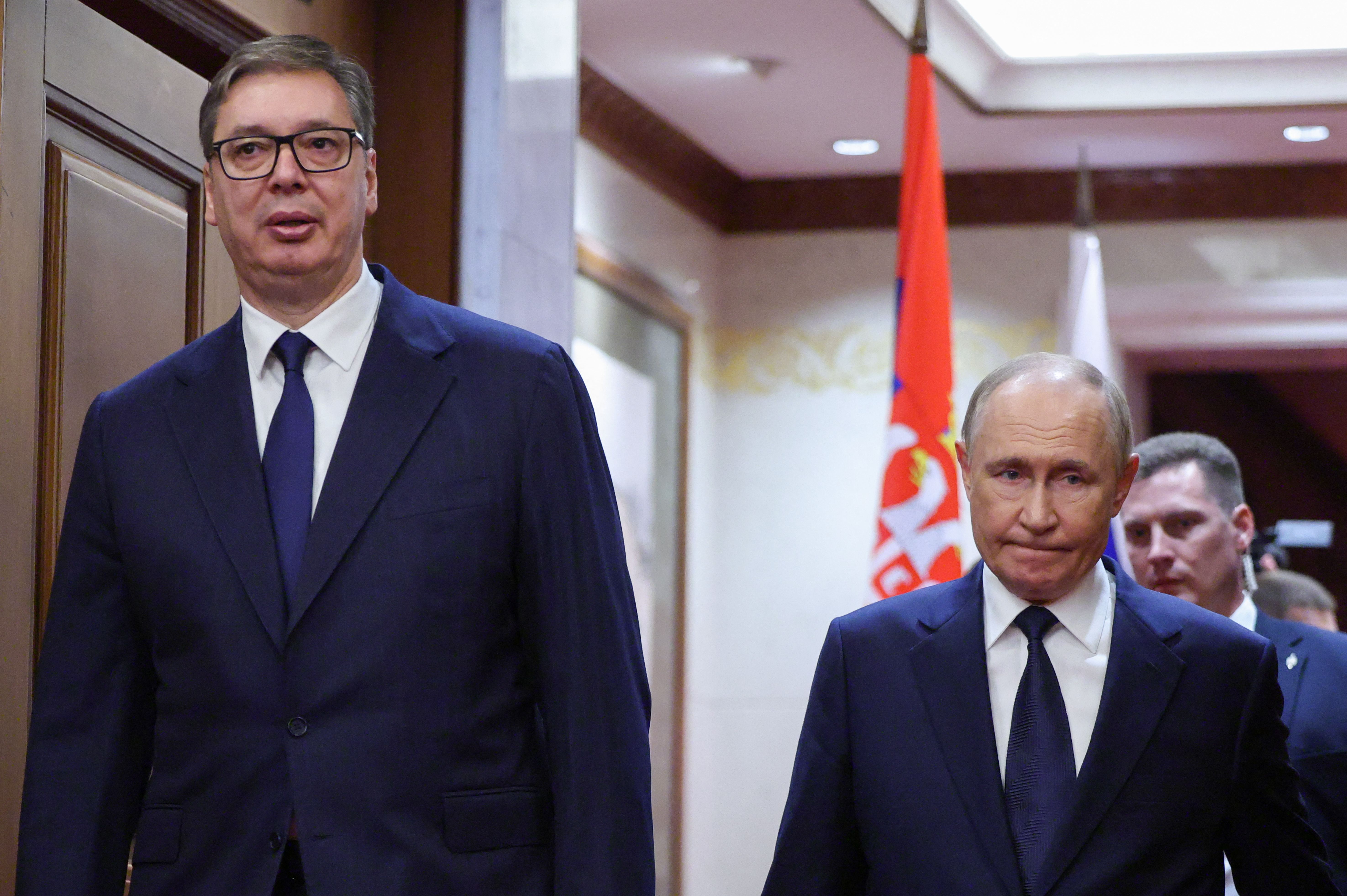 Russian President Vladimir Putin (R) walks with Serbian President Aleksandar Vucic for a meeting at the Diaoyutai State Guesthouse in Beijing on September 2, 2025.