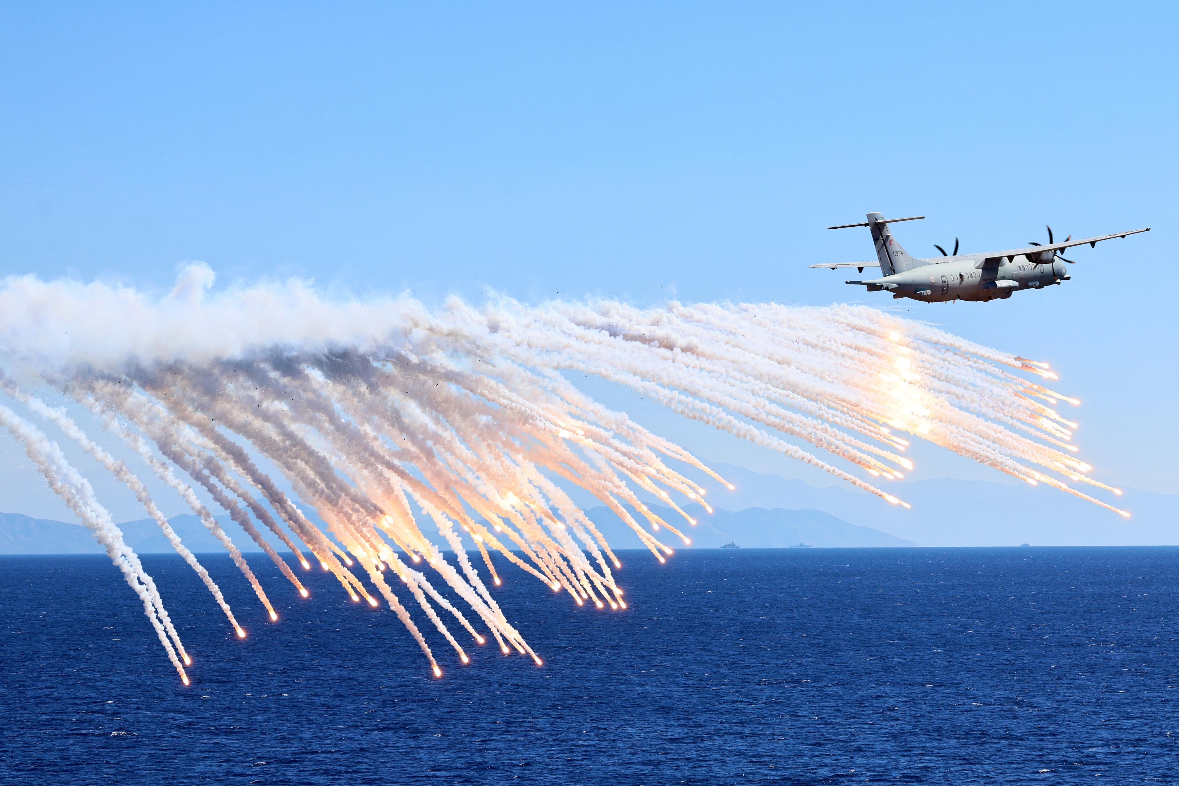 An ATR 72-600 TMPA (P-72) maritime patrol aircraft operated by the Turkish Navy releases countermeasure flares during the Denizkurdu-I/2026 Exercise in the Eastern Mediterranean, off the coast of Aksaz, at Marmaris in Mugla