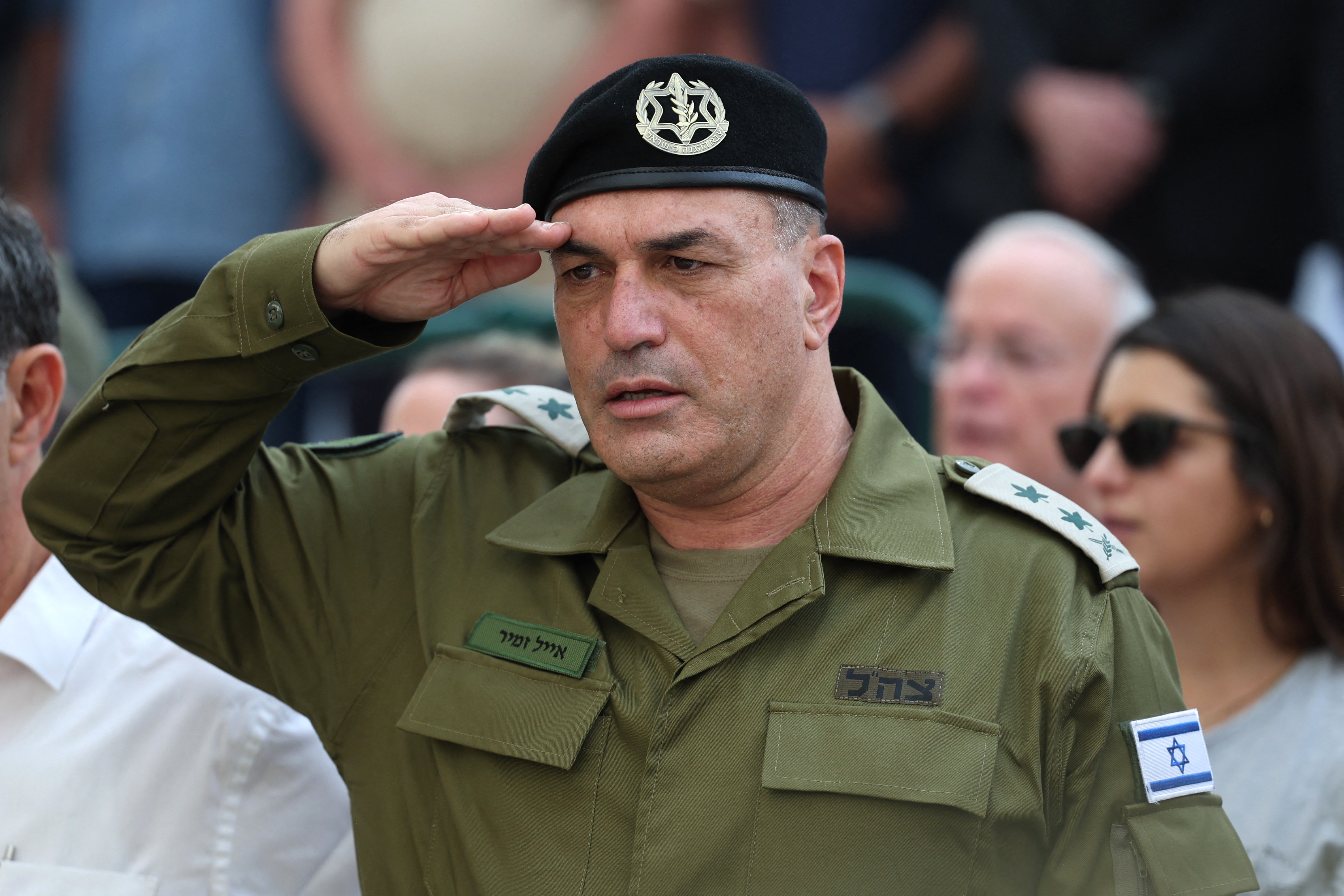 Israel's military chief Lieutenant General Eyal Zamir salutes during the funeral of Lieutenant Hadar Goldin who was killed during the six-week 2014 war in Gaza