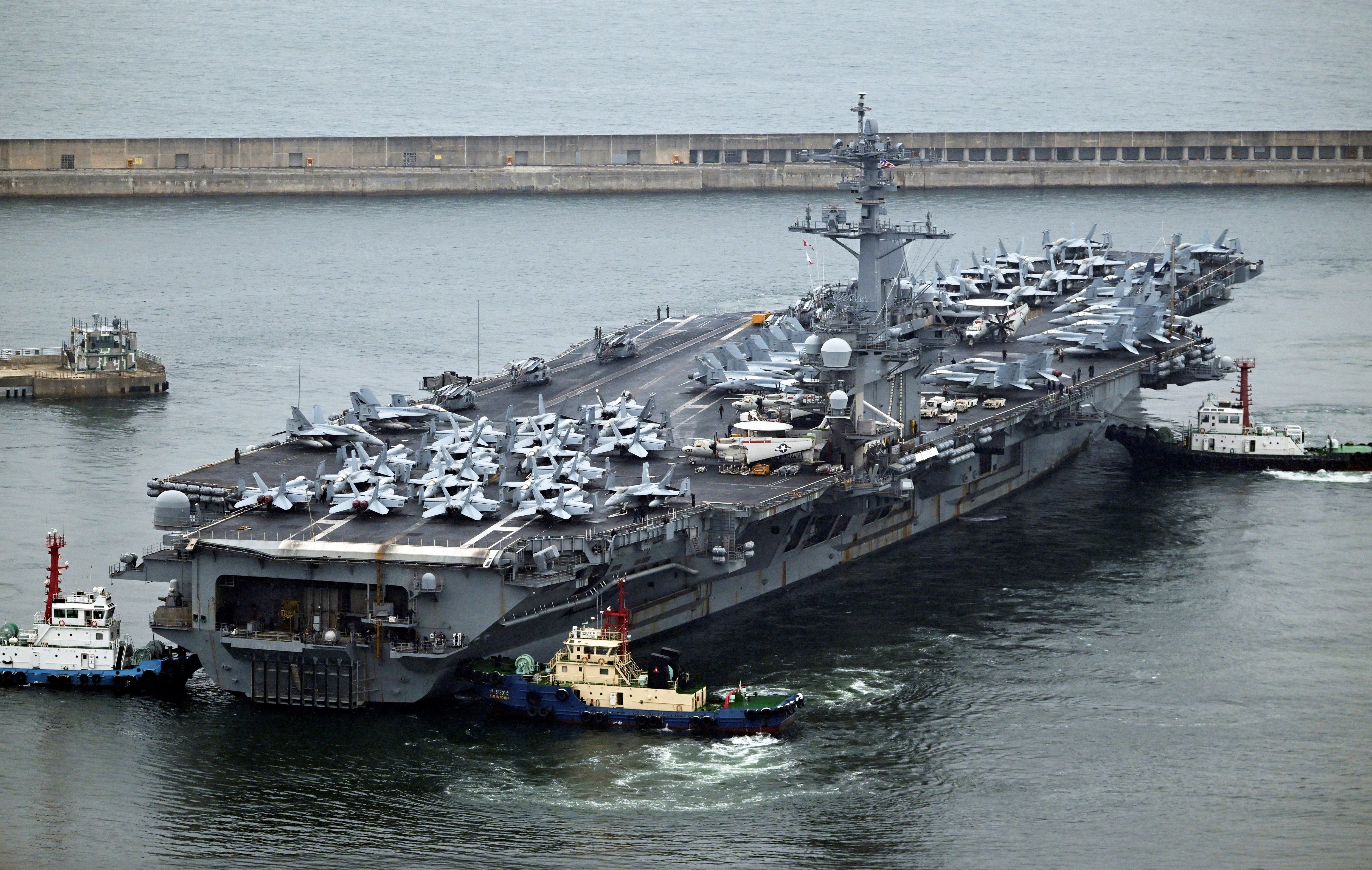 The Theodore Roosevelt (CVN 71) a Nimitz-class nuclear-powered aircraft carrier arrives in Busan on June 22, 2024. (Photo by SONG Kyung-Seok / POOL / AFP)