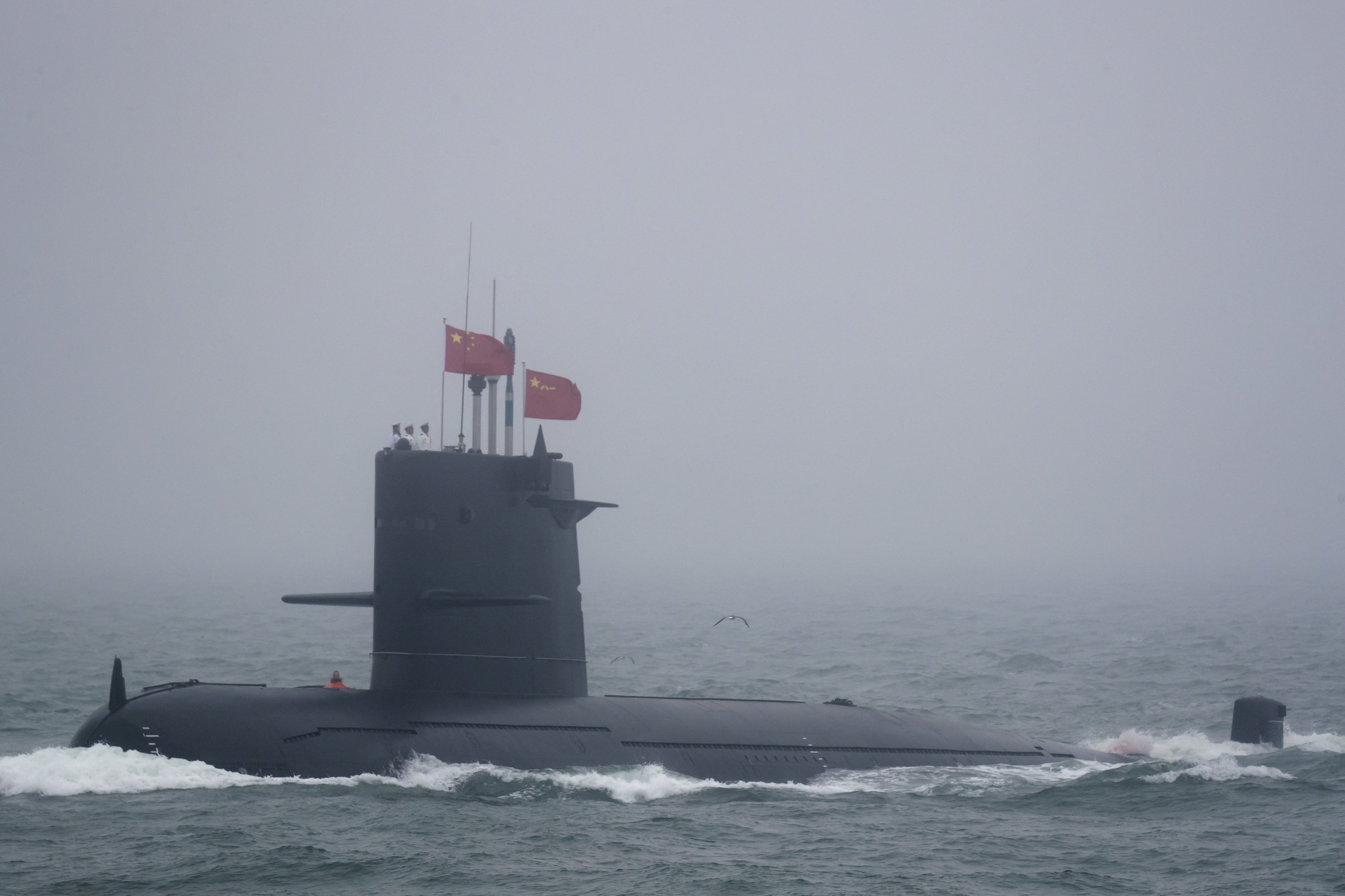 A Great Wall 236 submarine of the Chinese People's Liberation Army (PLA) Navy, billed by Chinese state media as a new type of conventional submarine, participates in a naval parade to commemorate the 70th anniversary of the founding of China's PLA Navy