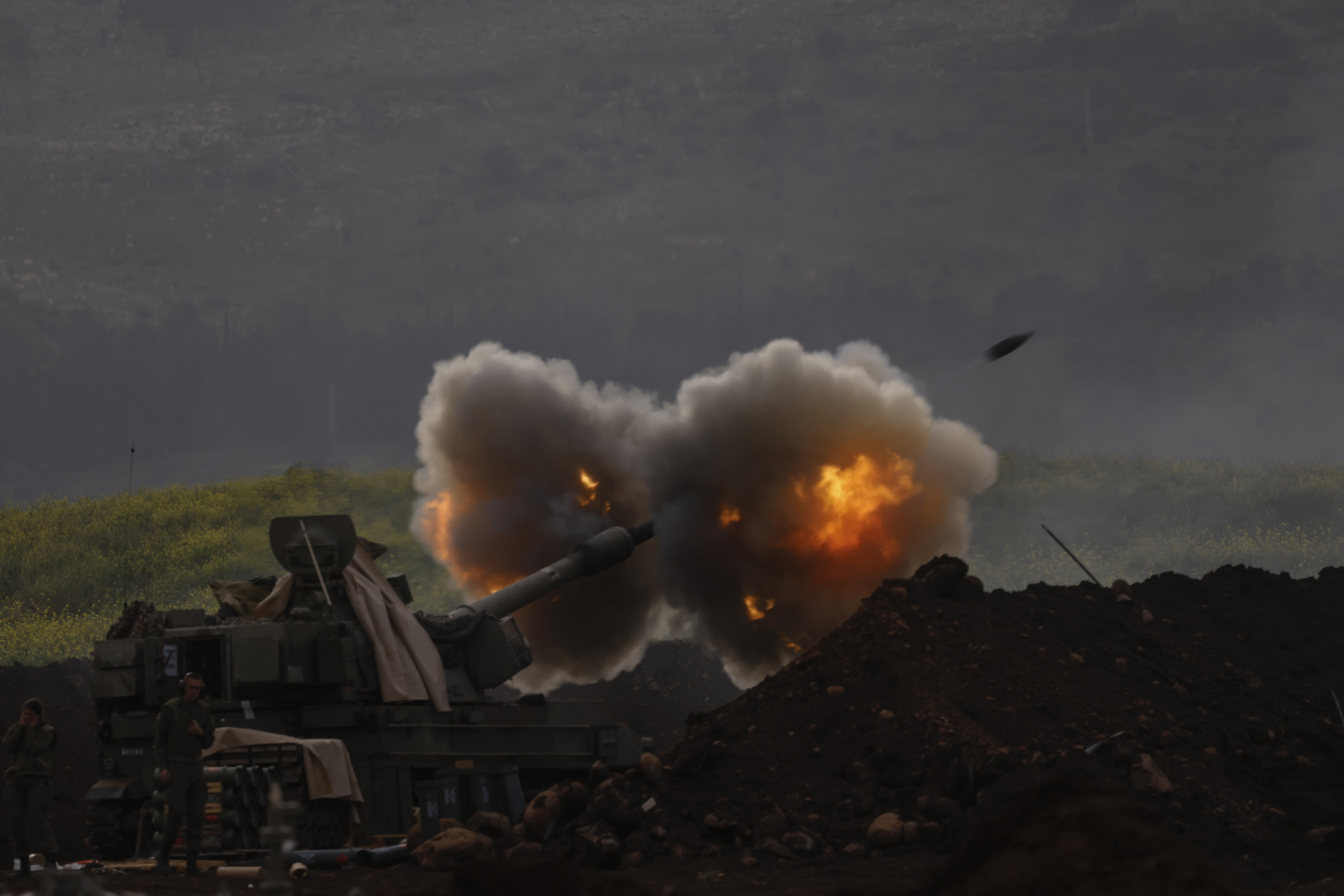 An Israeli artillery unit deployed at a position in the upper Galilee in northern Israel near the Lebanon border, fires towards southern Lebanon on March 14, 2026.