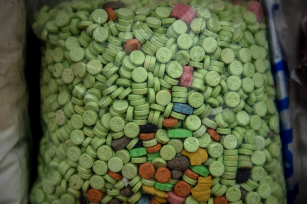 Packs of pills of ketamine are displayed before being set on fire during a destruction ceremony to mark the United Nations' "International Day against Drug Abuse and Illicit Trafficking" in Yangon on June 26, 2025. (Photo by Sai Aung MAIN / AFP)