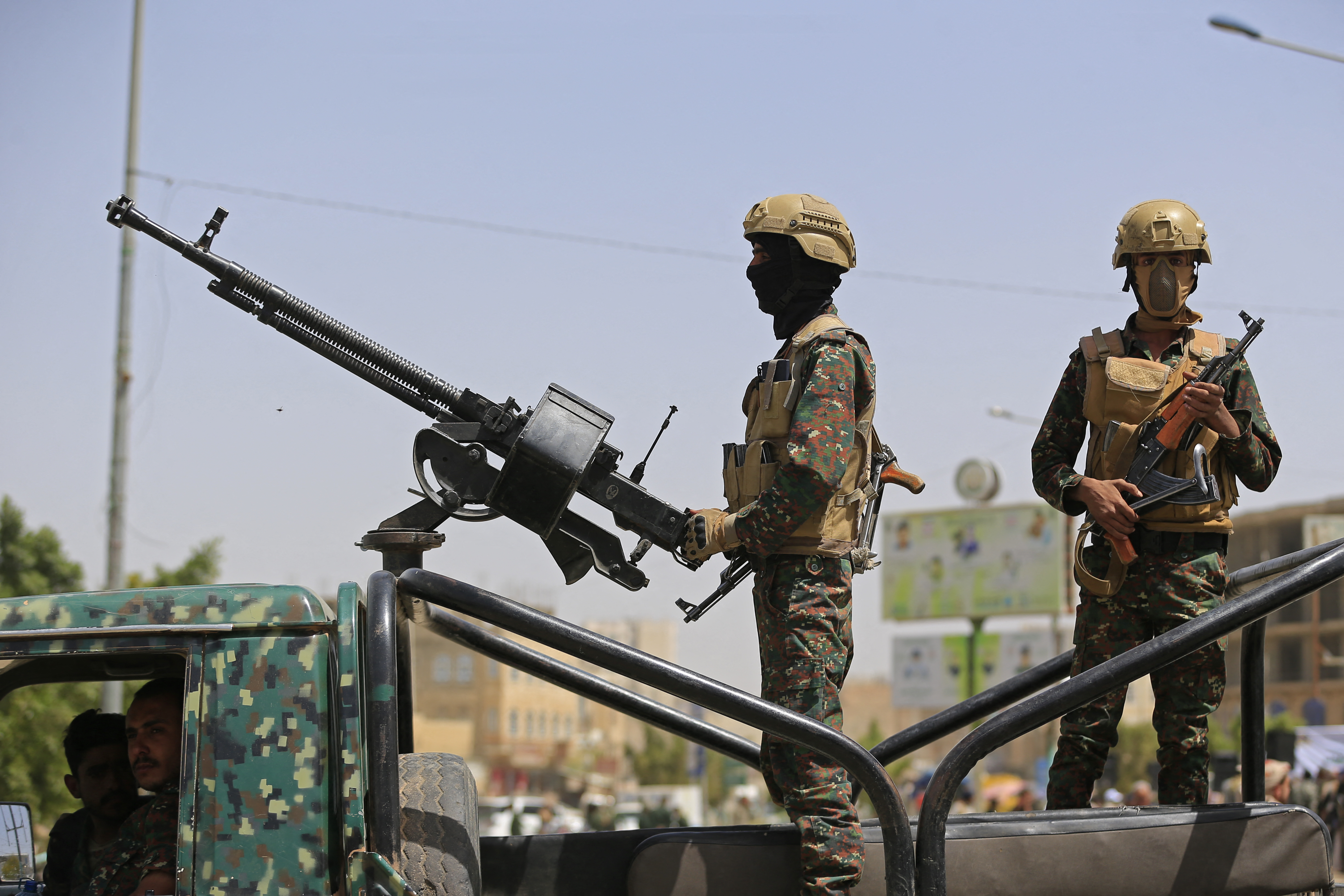 Yemeni security personnel keep vigil as supporters of Iran-backed Houthis, gather in Sanaa on April 2, 2026, during a protest against the Israeli parliament's approval of a new death penalty bill for Palestinians convicted of deadly attacks