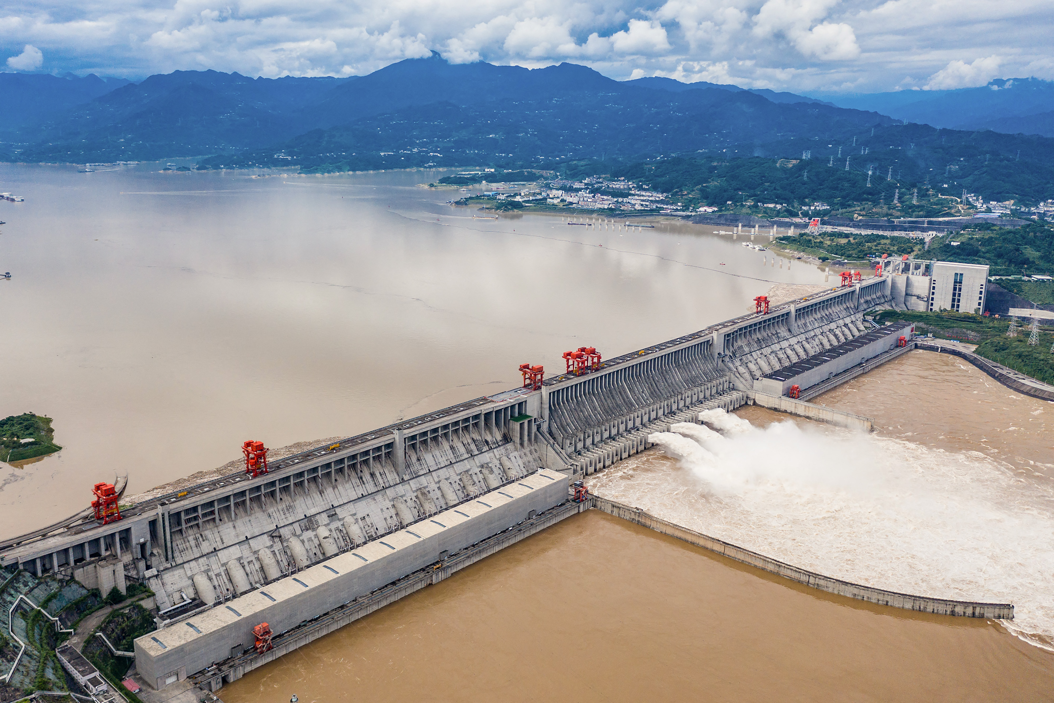 This aerial photo taken on September 7, 2020 shows water being released from the Three Gorges Dam, a hydropower project on the Yangtze river, in Yichang, central China's Hubei province. (Photo by CN-STR / AFP) / China OUT