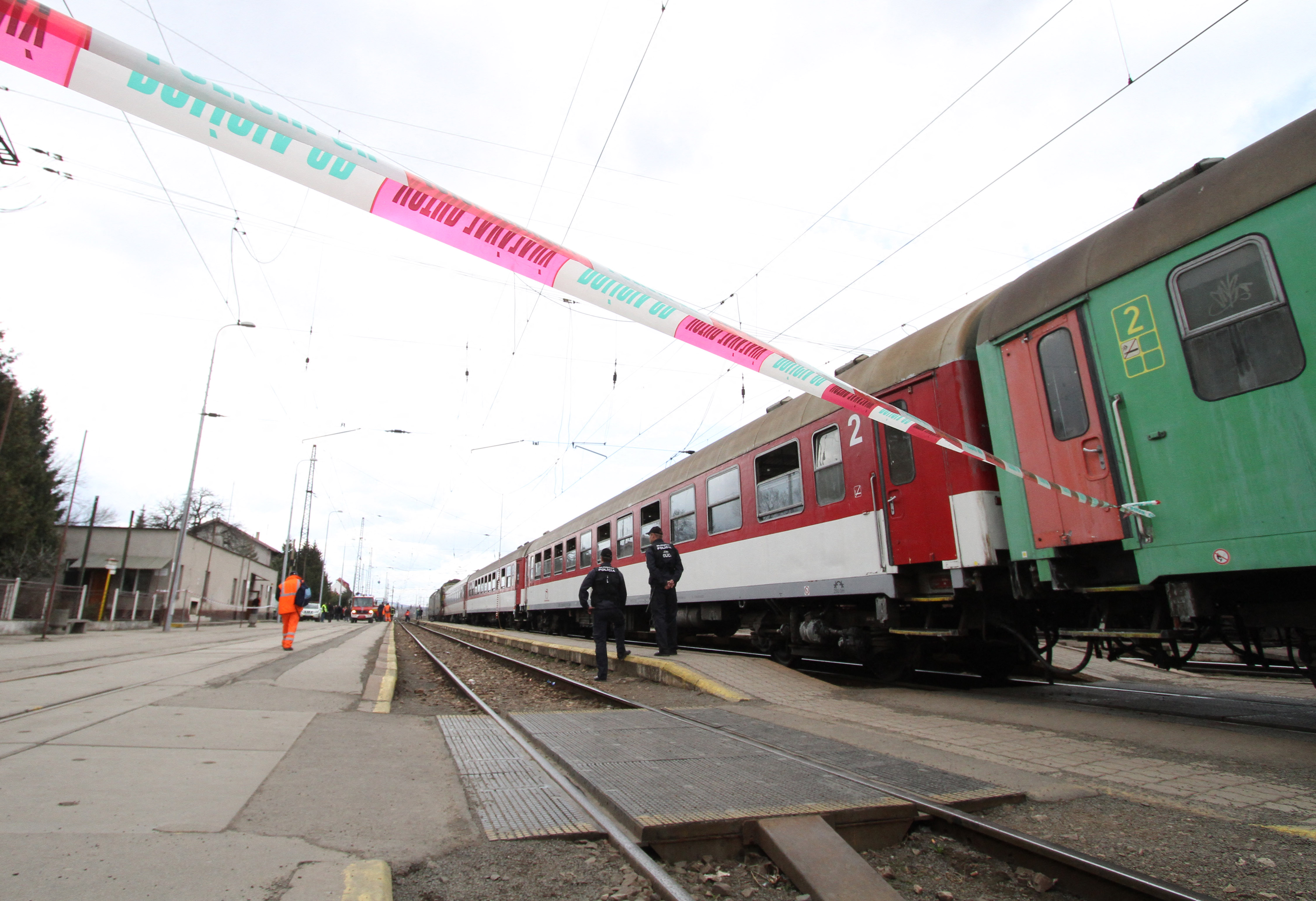 Railway policemen guard the accident scene (Photo by JOE KLAMAR / AFP)