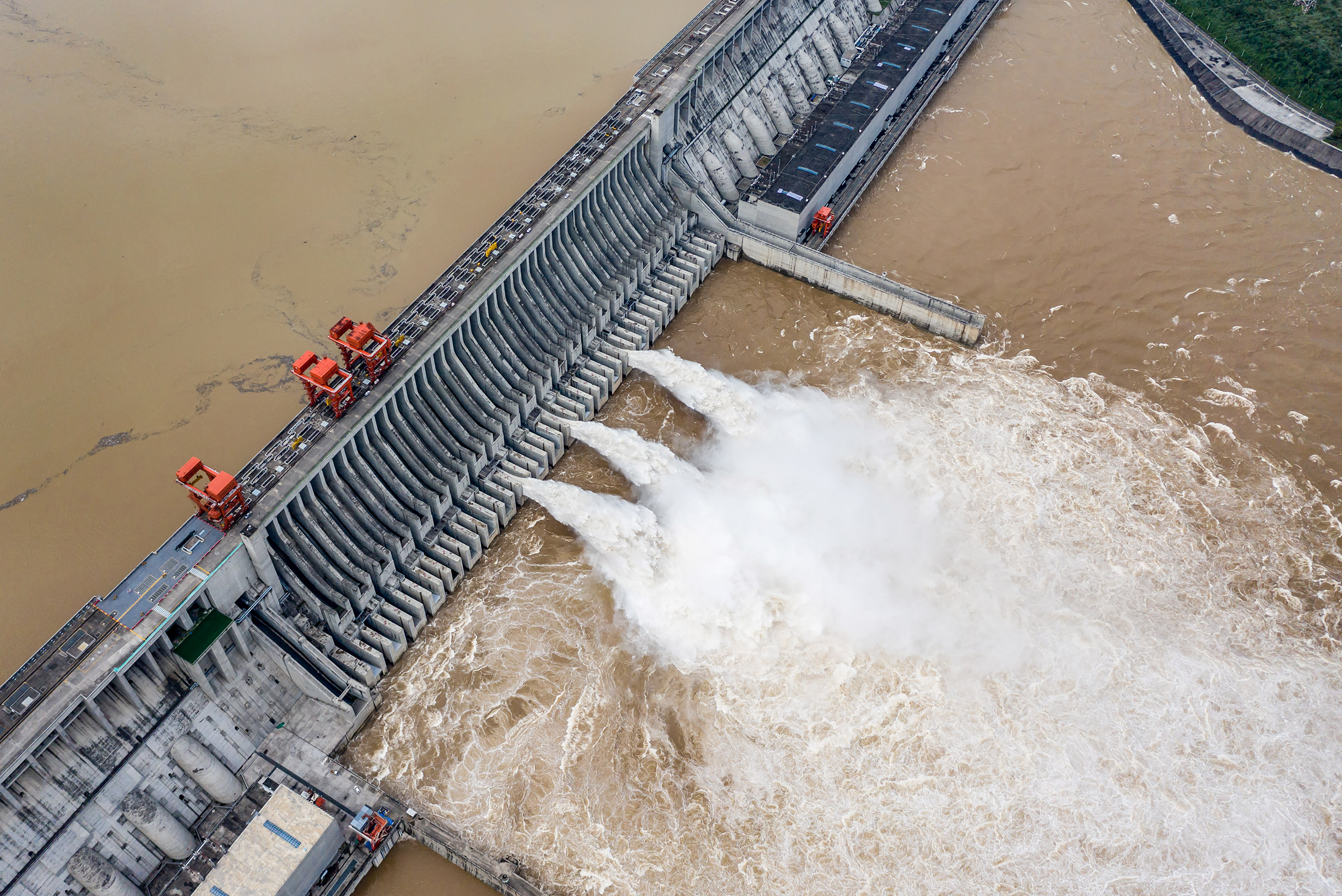 This aerial photo taken on September 7, 2020 shows water being released from the Three Gorges Dam, a hydropower project on the Yangtze river, in Yichang, central China's Hubei province. (Photo by CN-STR / AFP) / China OUT