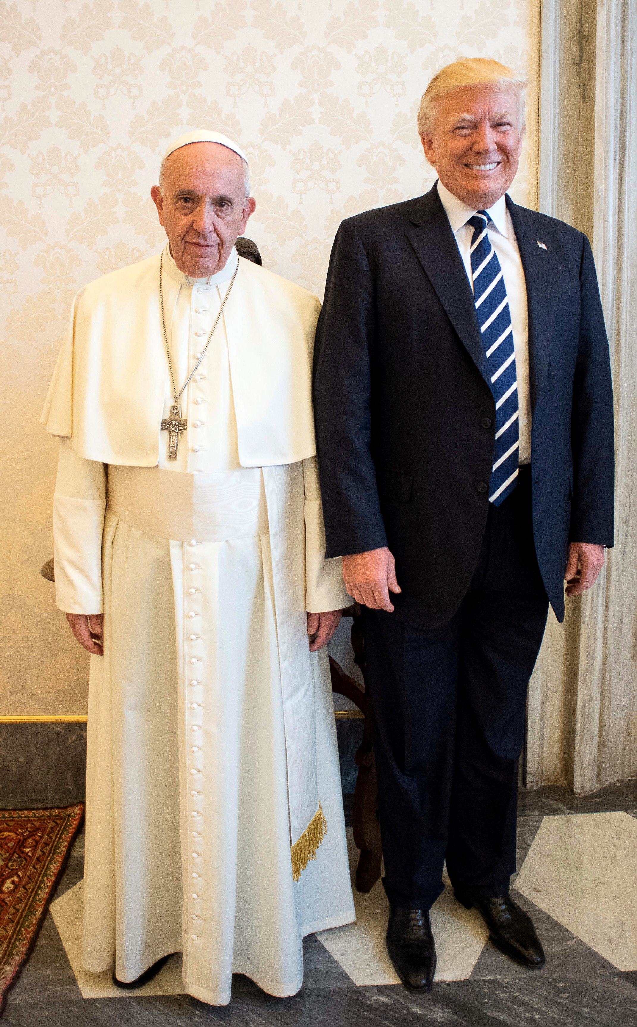 Pope Francis (L) with US President Donald Trump. (Photo by HO / OSSERVATORE ROMANO / AFP)