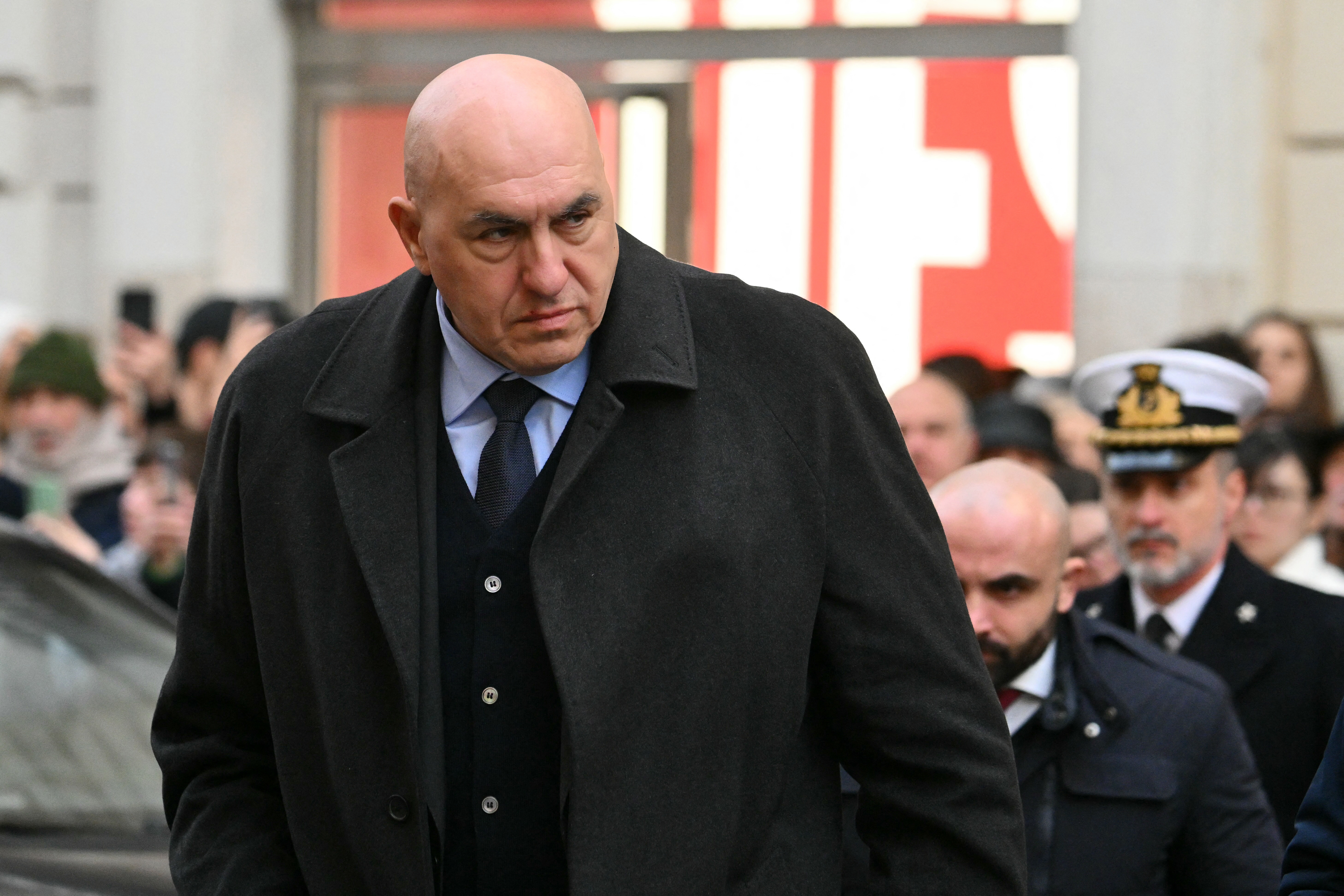 Italy's Defence Minister Guido Crosetto, arrives at the Basilica of Saints Ambrose and Charles for a mass in memory of the victims of the Crans-Montana New-Year fire, in Rome on January 9, 2026. (Photo by Alberto PIZZOLI / AFP)