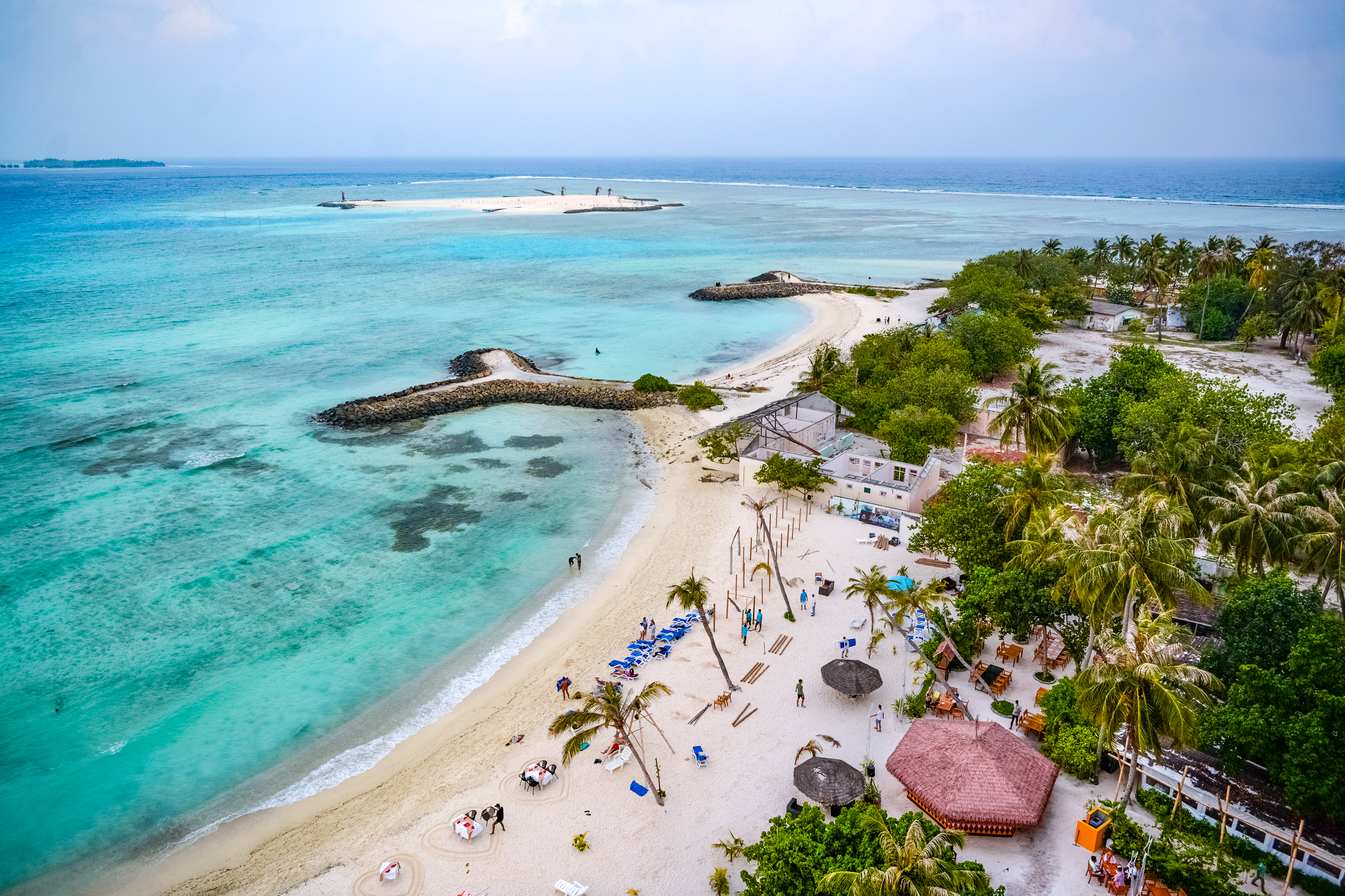 Tourists visit a beach at Maafushi island in the Maldives on October 22, 2024.