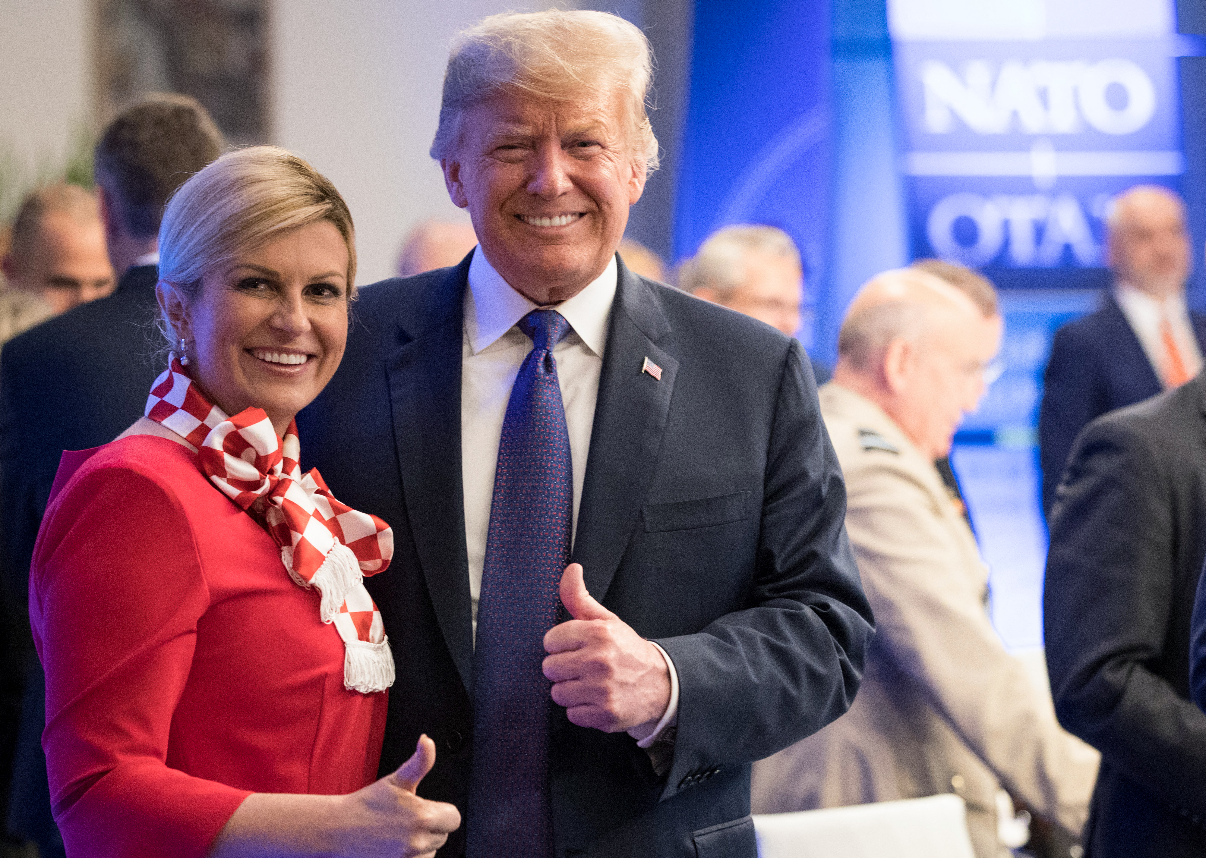 Croatia's President Kolinda Grabar-Kitarovic (L) and US President Donald Trump. (Photo by BENOIT DOPPAGNE / POOL / AFP)