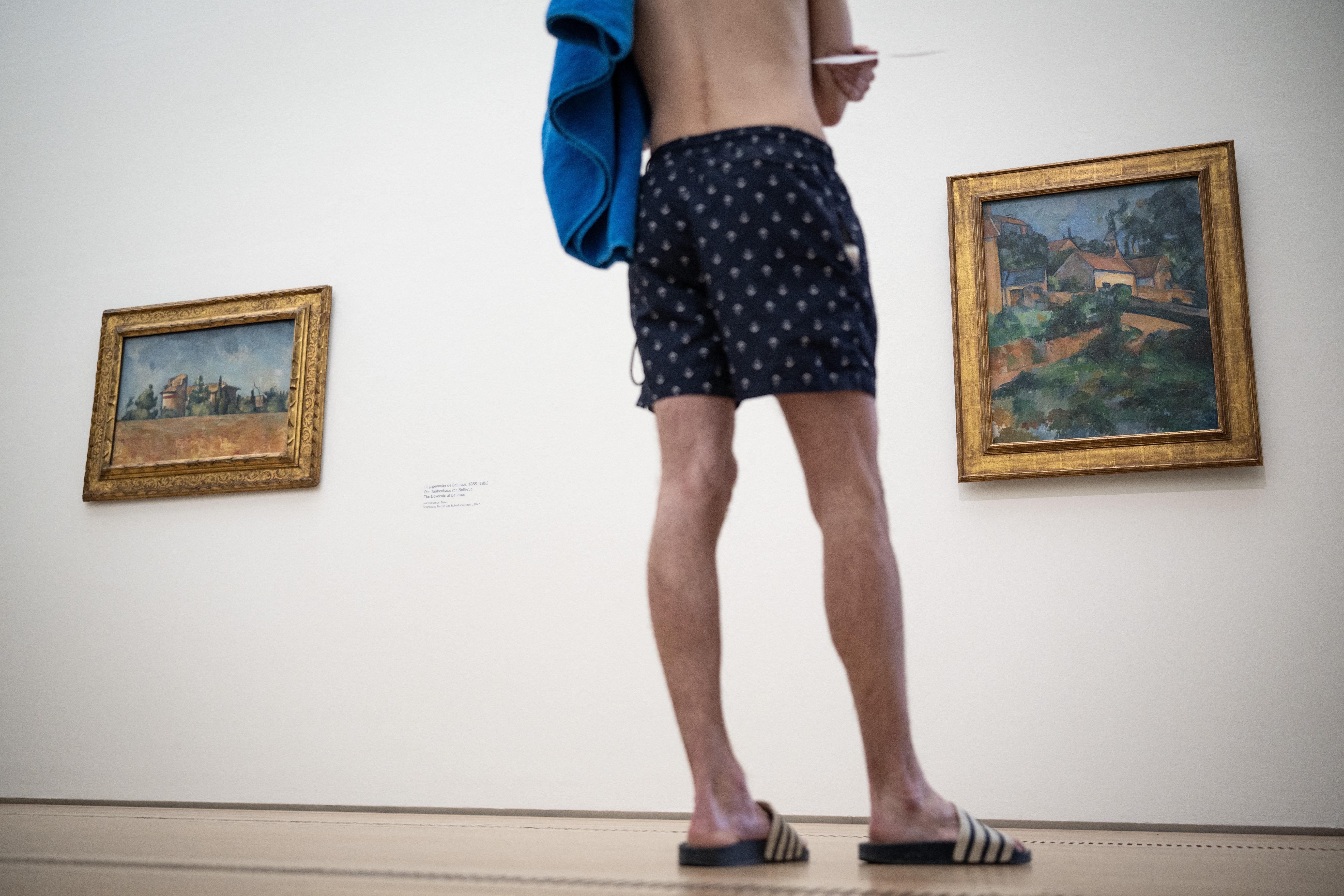 A visitor wearing a swimsuit. (Photo by SEBASTIEN BOZON / AFP) / RESTRICTED TO EDITORIAL USE - MANDATORY MENTION OF THE ARTIST UPON PUBLICATION - TO ILLUSTRATE THE EVENT AS SPECIFIED IN THE CAPTION
