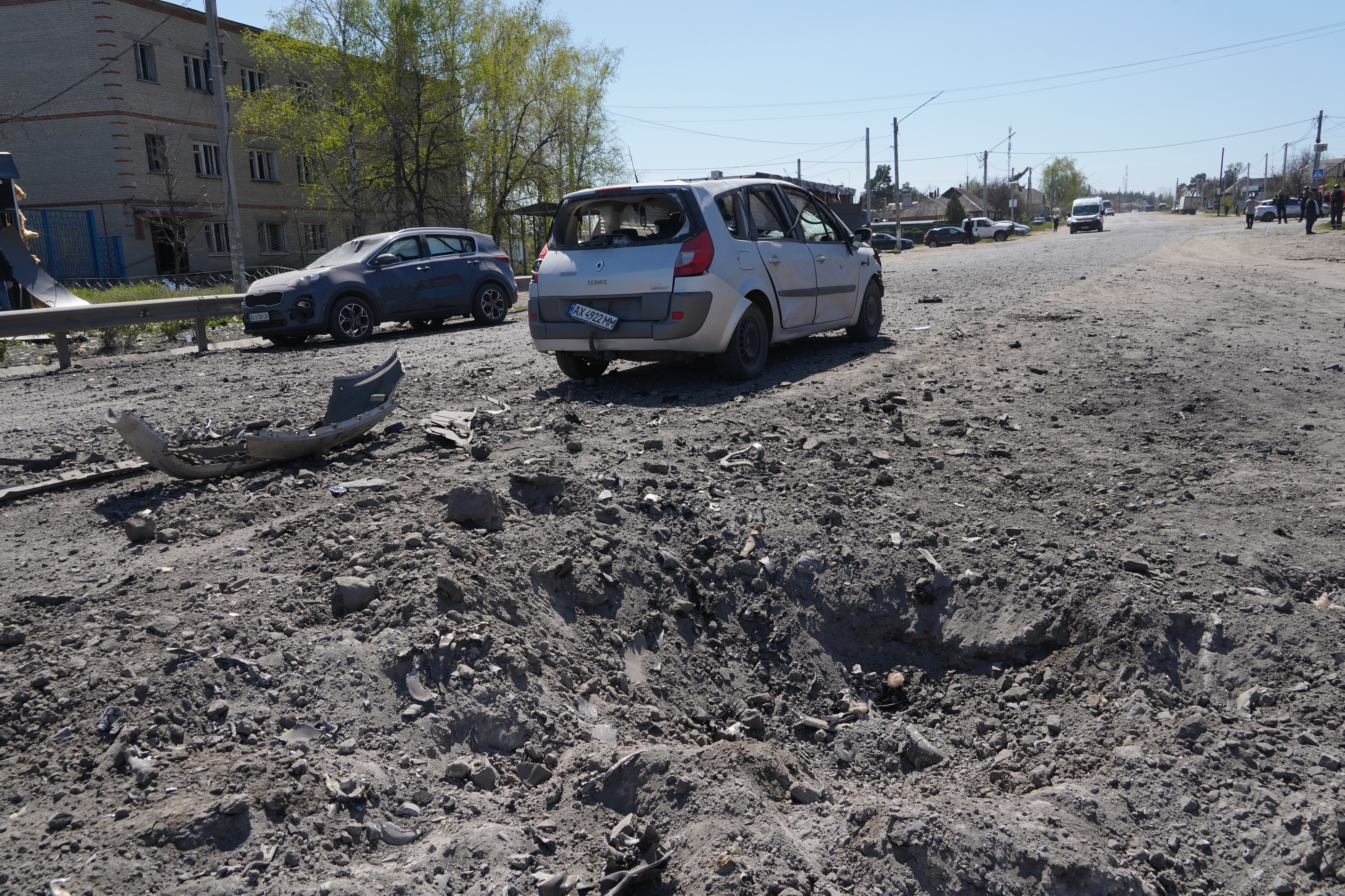 A crater is seen in a residential neighbourhood following a Russian missile attack in Merefa, Kharkiv region, Ukraine, Monday, May 4, 2026. (AP Photo/Andrii Marienko)