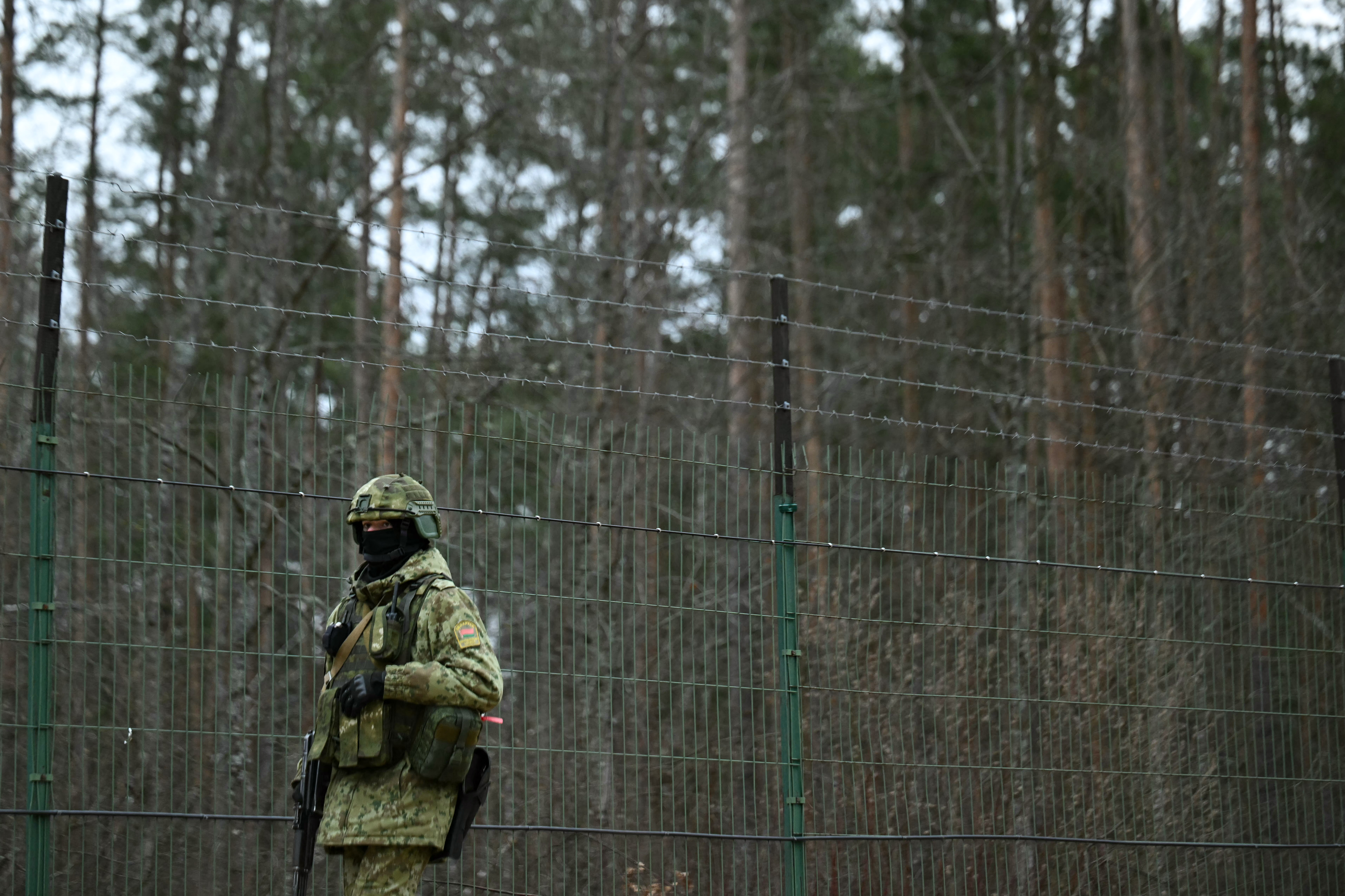 A Belarusian border guard patrols along the border between Belarus and Ukraine on January 28, 2025. (Photo by Natalia KOLESNIKOVA / AFP)