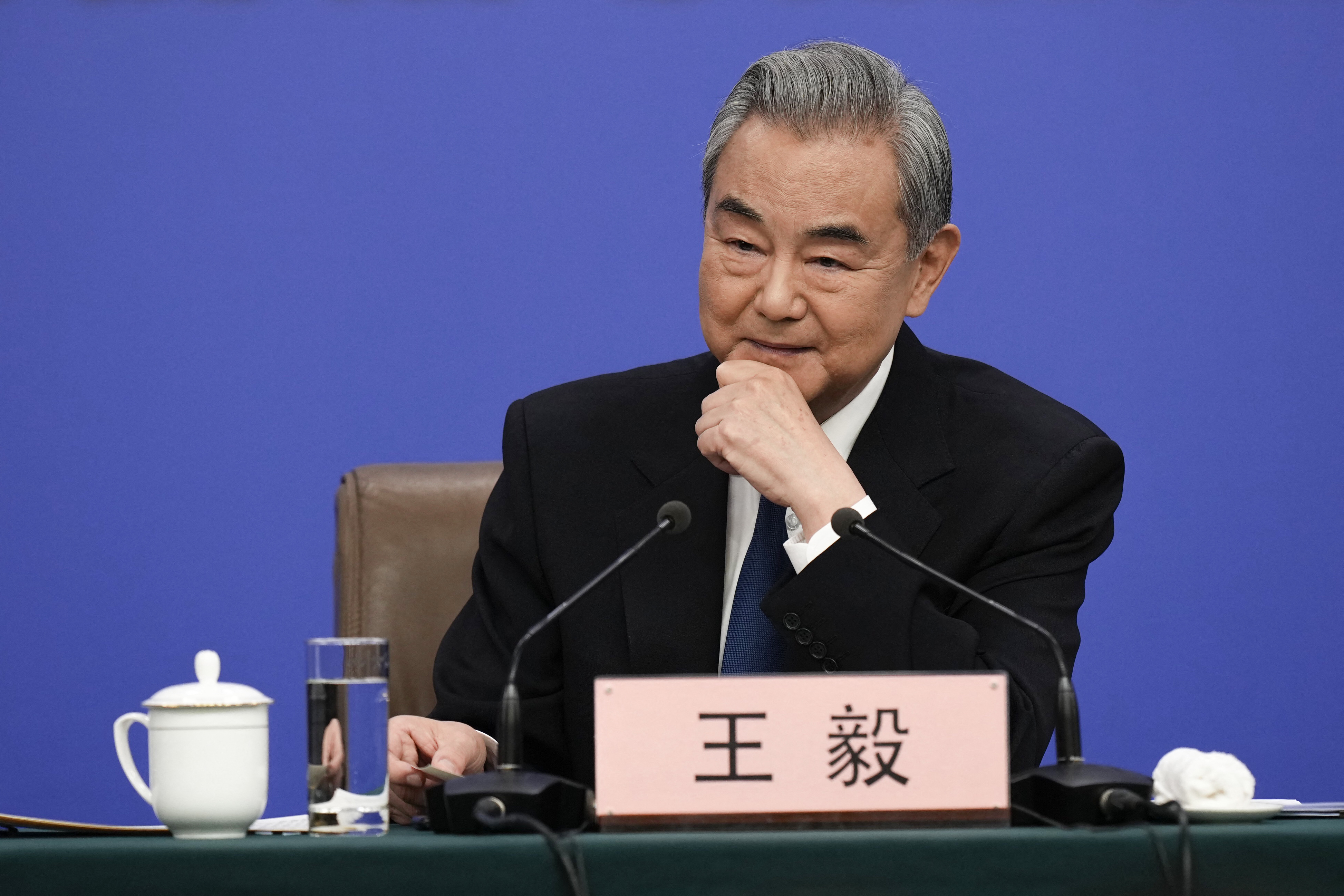 China's Foreign Minister Wang Yi, who is also a member of the Political Bureau of the Communist Party of China Central Committee, attends a press conference on the country's foreign policy
