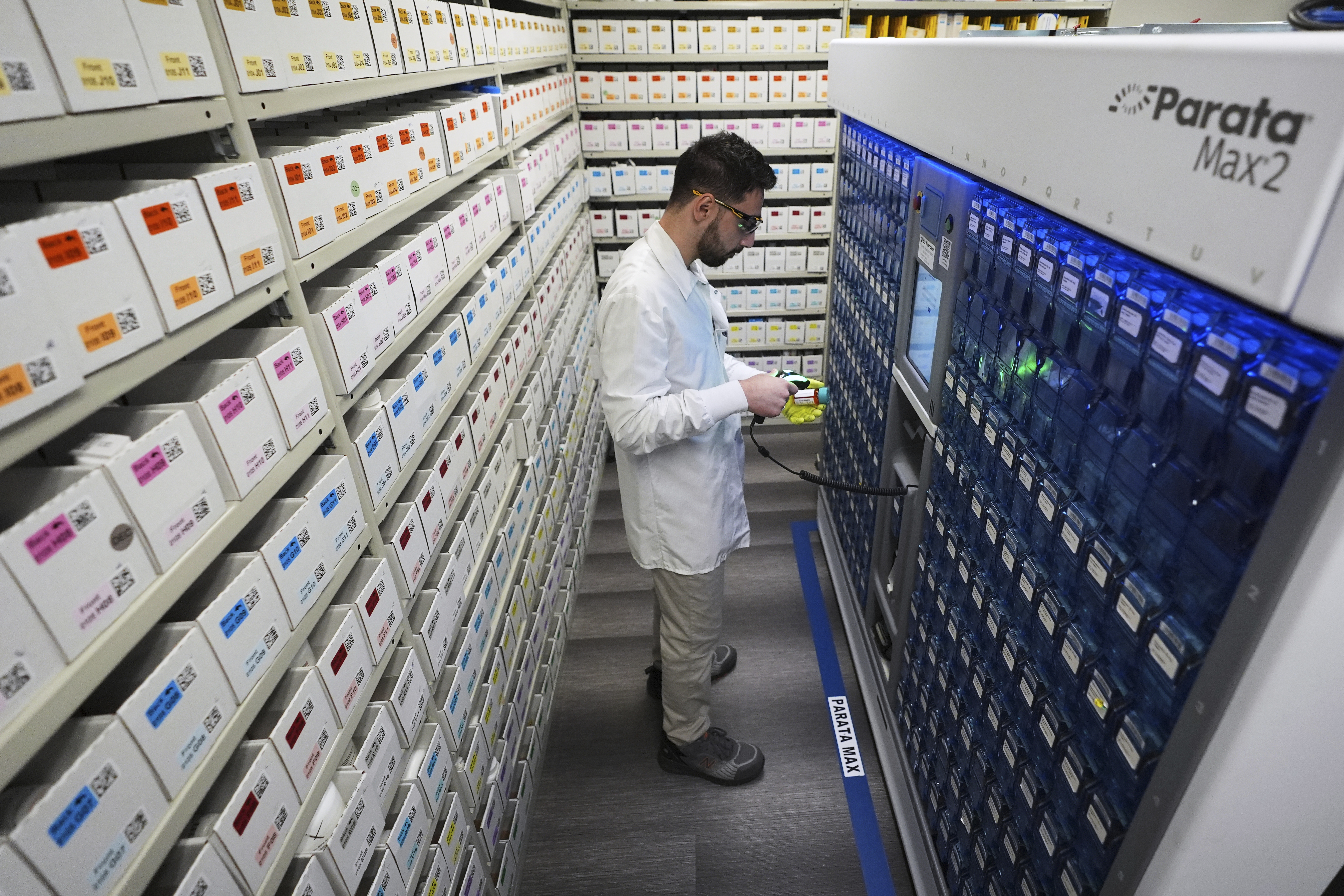 Pharmacist Alan Alnajjar works to fill a prescription at an Amazon Pharmacy fulfillment center Tuesday, July 29, 2025, in Wixom, Mich. (AP Photo/Paul Sancya)