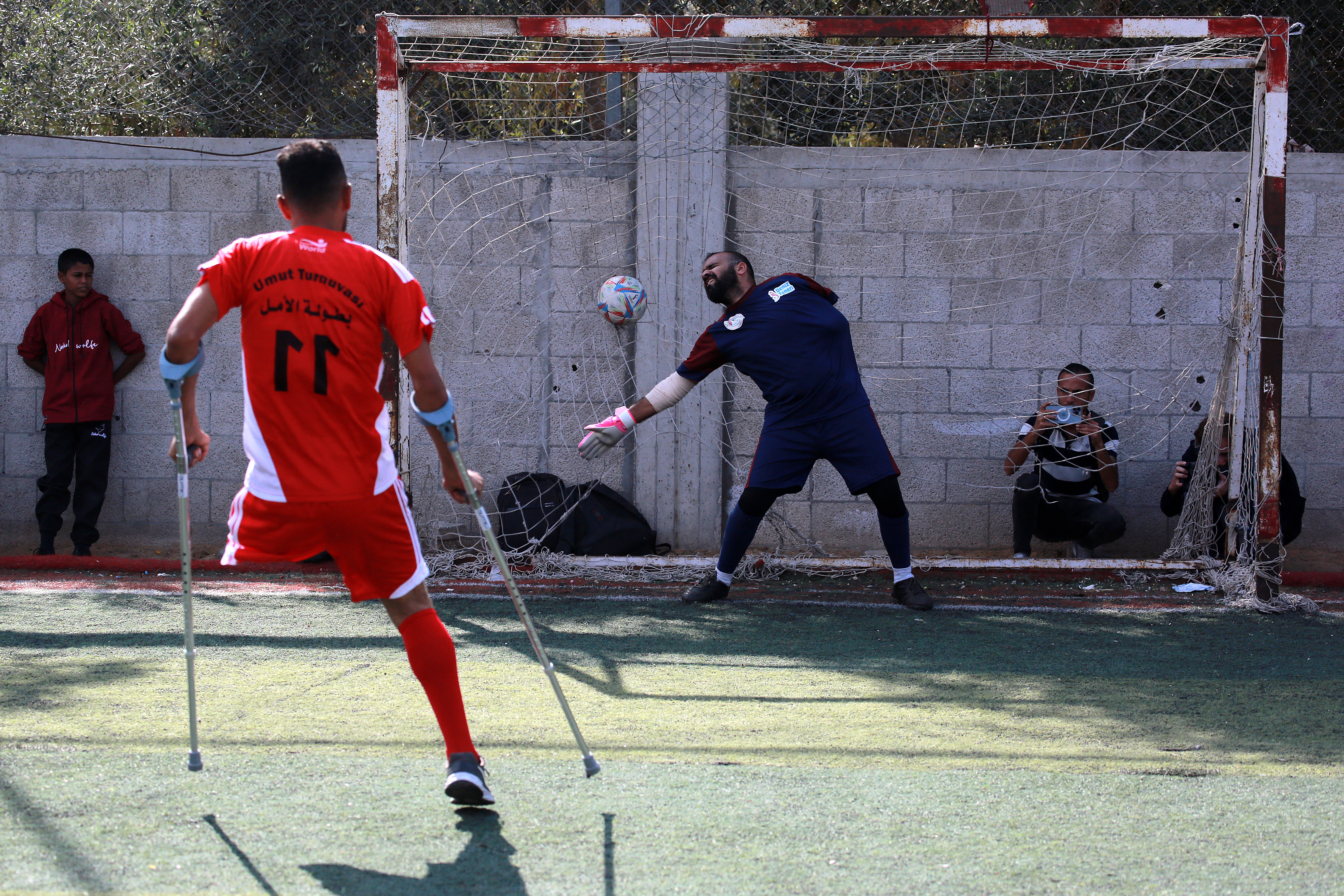 Palestinian amputees take part in a football match as part of the Hope Tournament organised by the Deniz Feneri Association and the Palestine Amputee Football Association in Deir al-Balah in the central Gaza Strip on November 17, 2025.