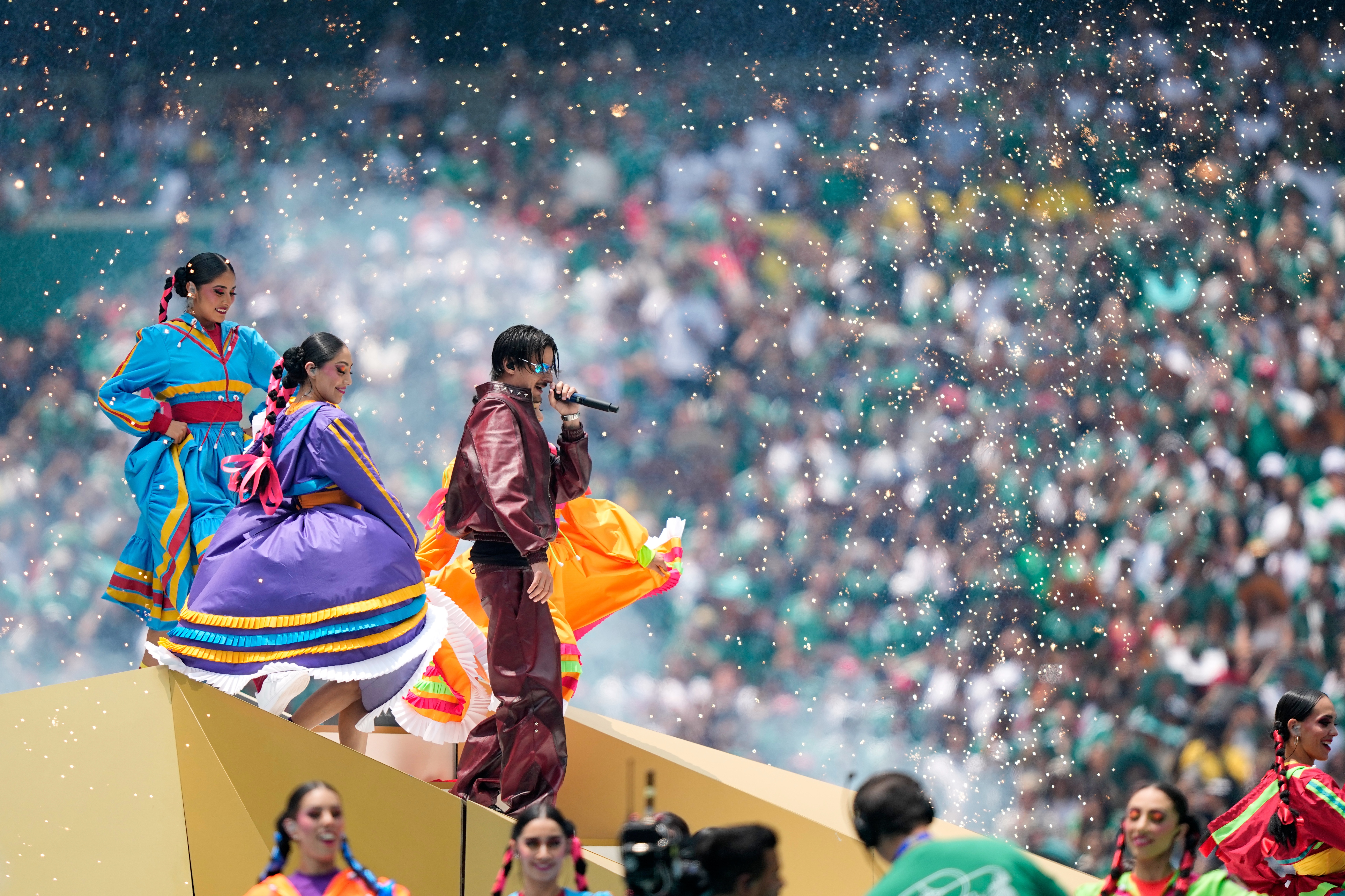Colombian singer J Balvin performs before the start of the World Cup Group A soccer match between Mexico and South Africa in Mexico City, Thursday, June 11, 2026. (AP Photo/Natacha Pisarenko)