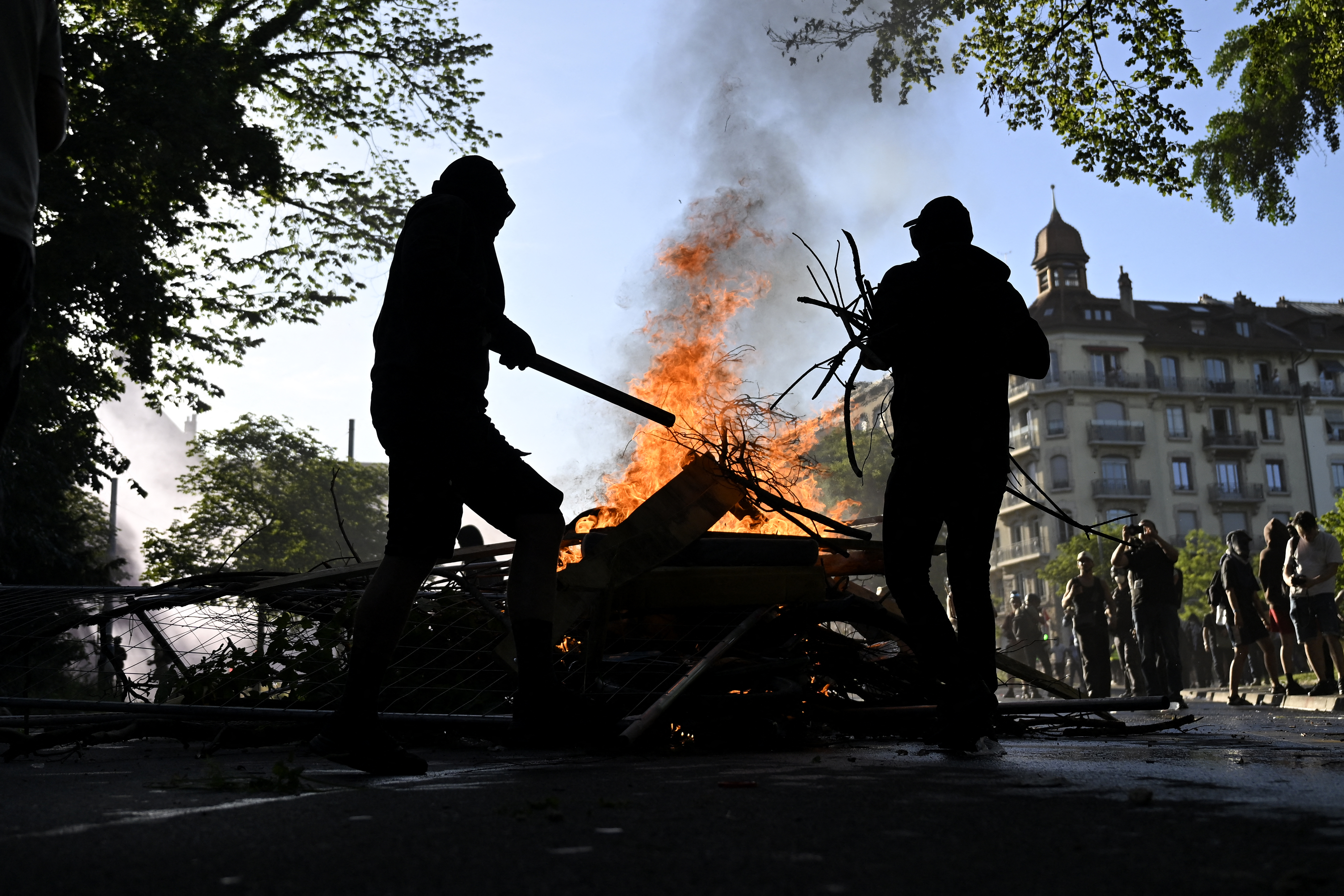 Demonstrators during a rally of a "No-G7" coalition. (Photo by Gabriel Monnet / AFP)