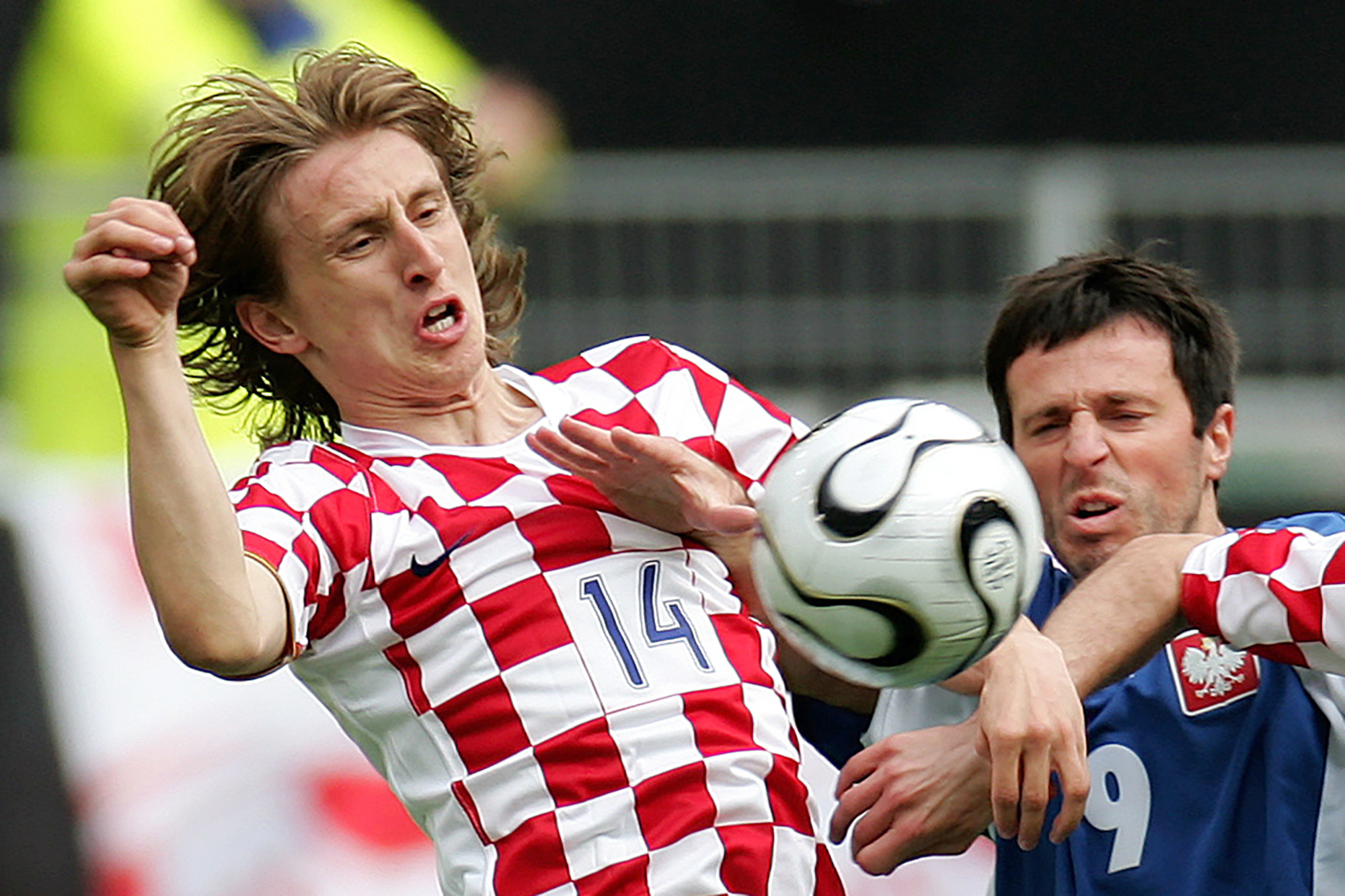FILE - Croatia's Luka Modric, left, and Poland's Maciej Zurawski2006. (AP Photo/Fabian Bimmer, File)