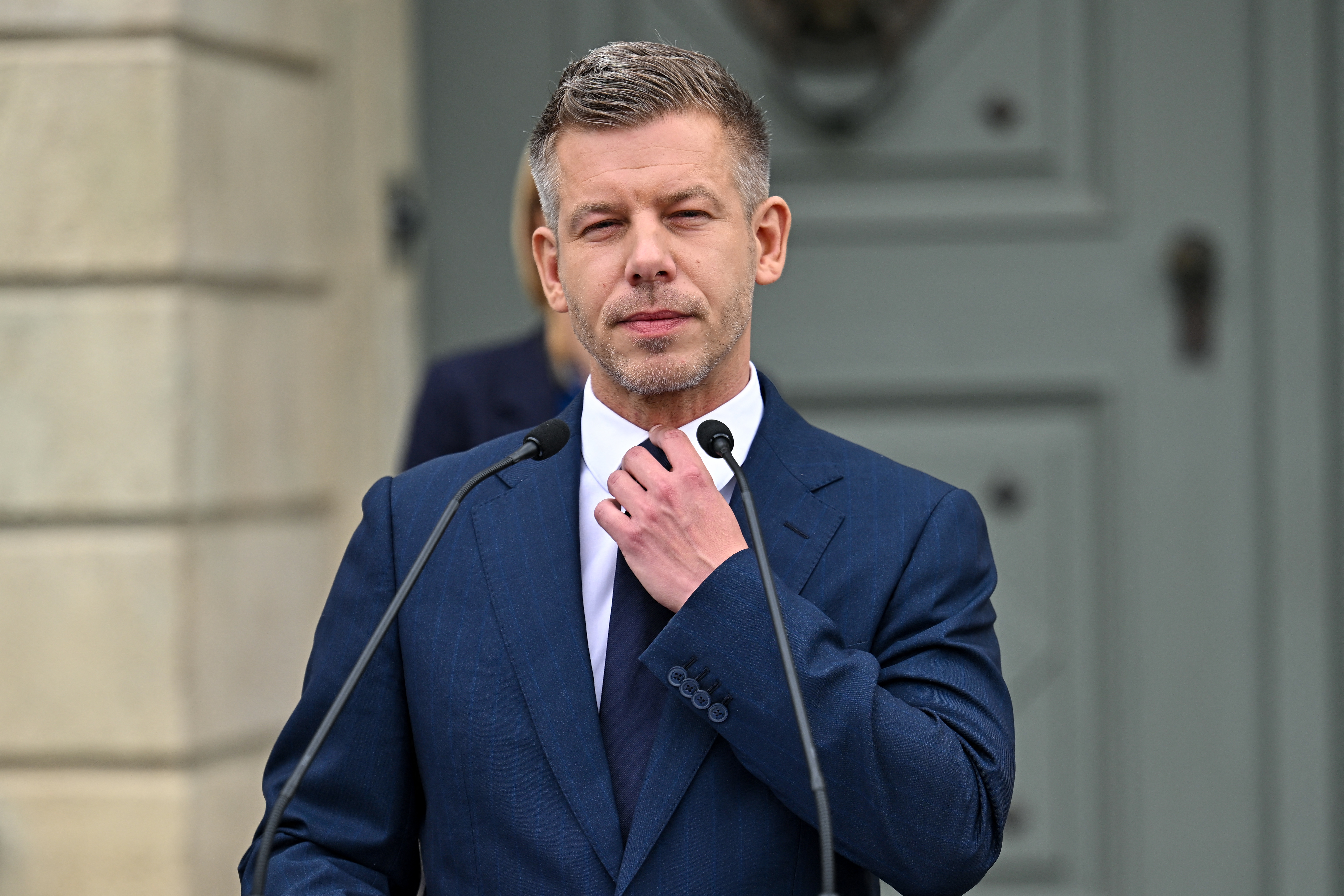 Hungary’s Prime Minister Peter Magyar adjusts his tie during a door-step presser after a meeting with Hungary's President at the presidential office in Sandor-palace, Budapest, Hungary, on June 1, 2026.