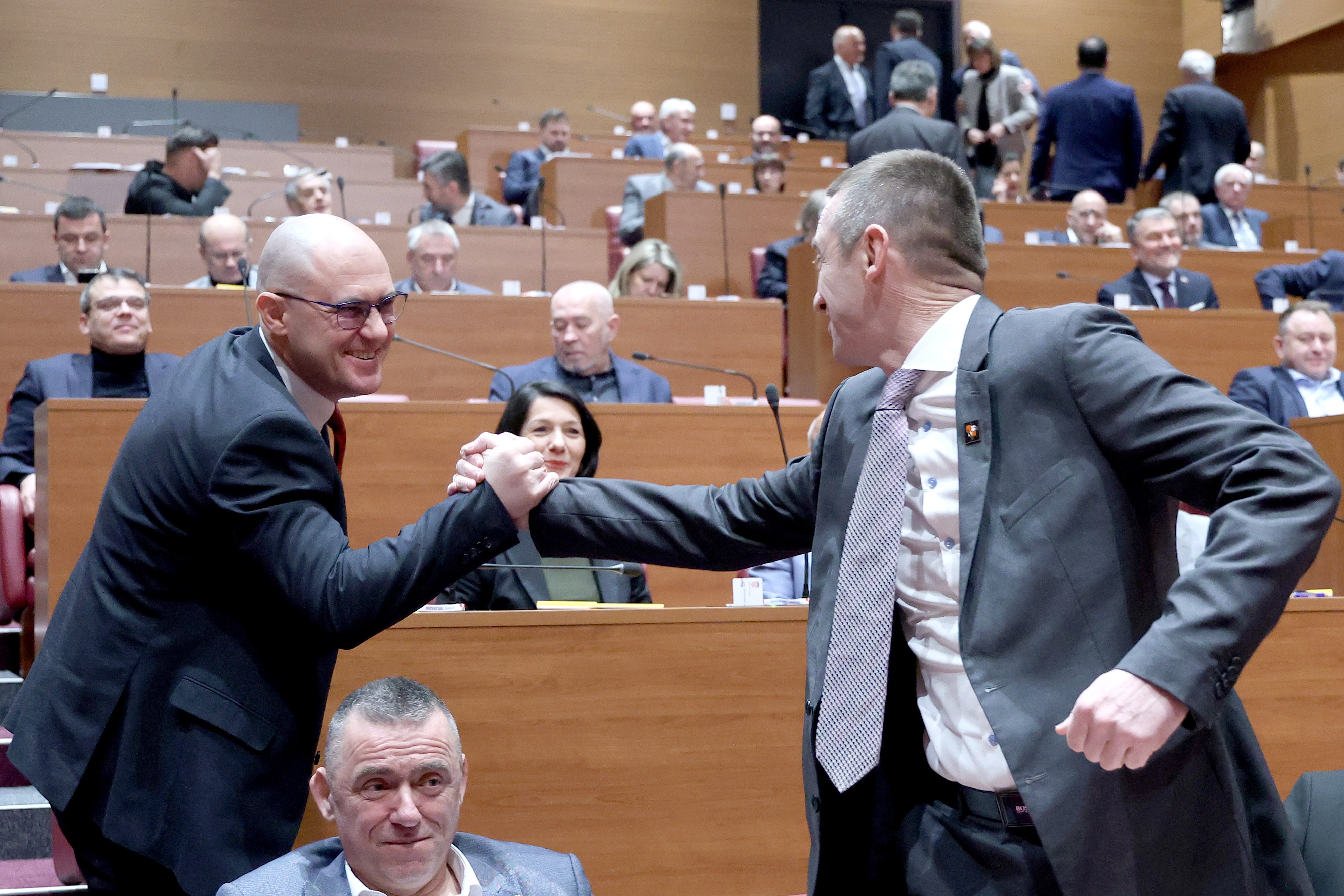 21.02.2025., Zagreb - Ivan Penava i Josip Dabro srcadno su se pozdravili u sabornici. Photo: Patrik Macek/PIXSELL