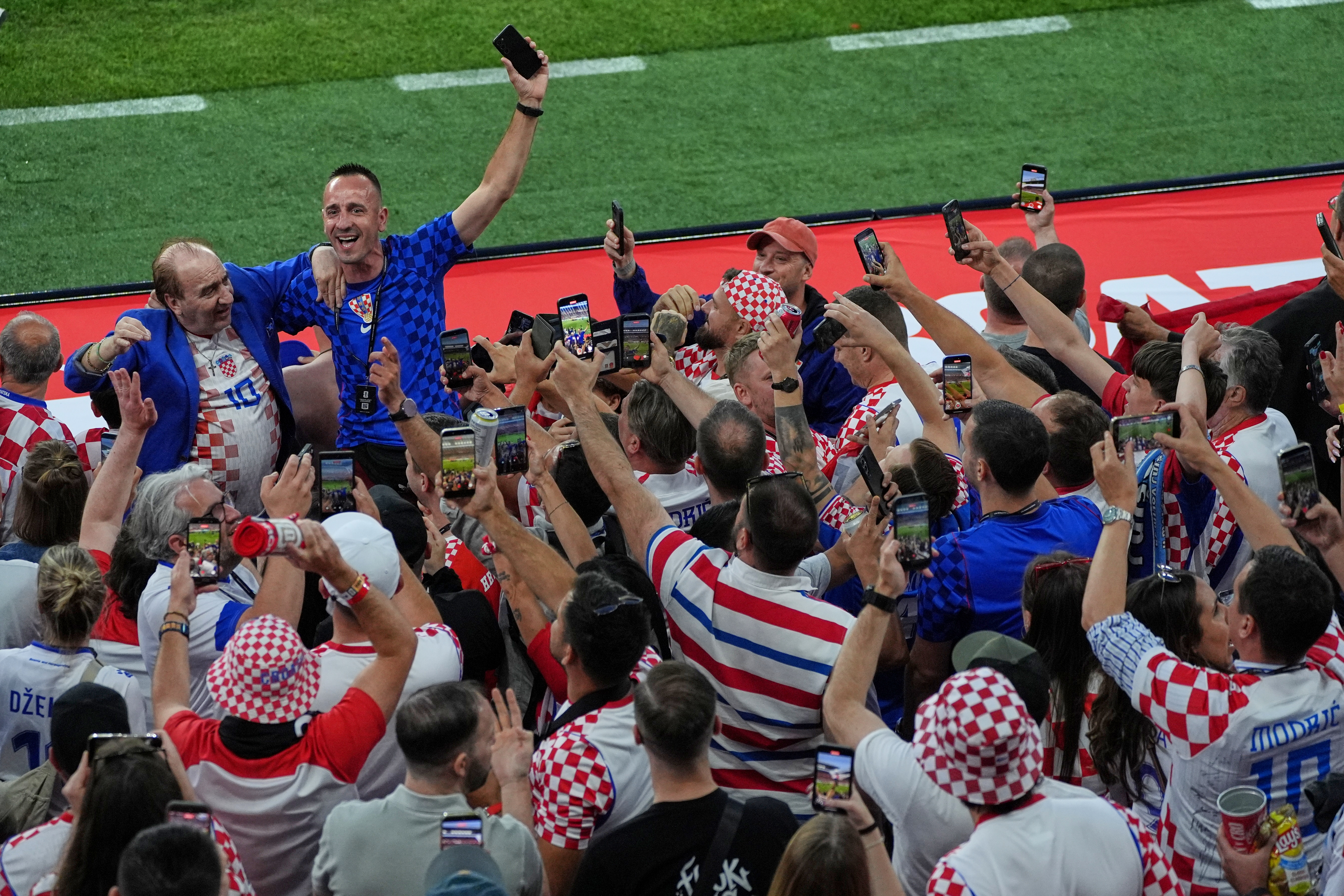 Croatia fans celebrate after the World Cup Group L soccer match between Panama and Croatia in Toronto, Tuesday, June 23, 2026. (AP Photo/Alexandra Antoniono)