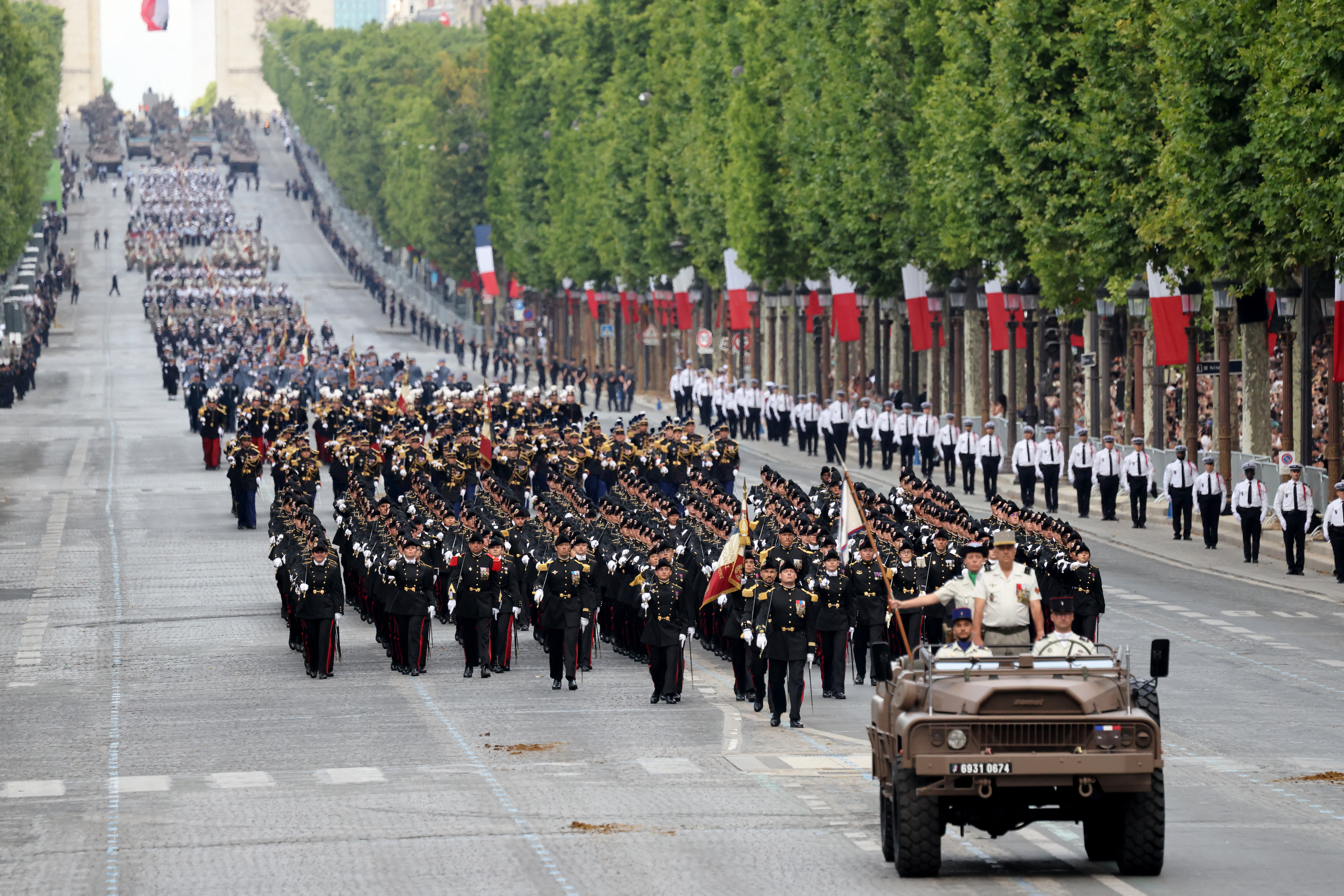 French Ecole Polytechnique members parade during the annual Bastille Day military parade on the Champs-Elysees Avenue in Paris on July 14, 2025. (Photo by Ludovic MARIN / AFP)
