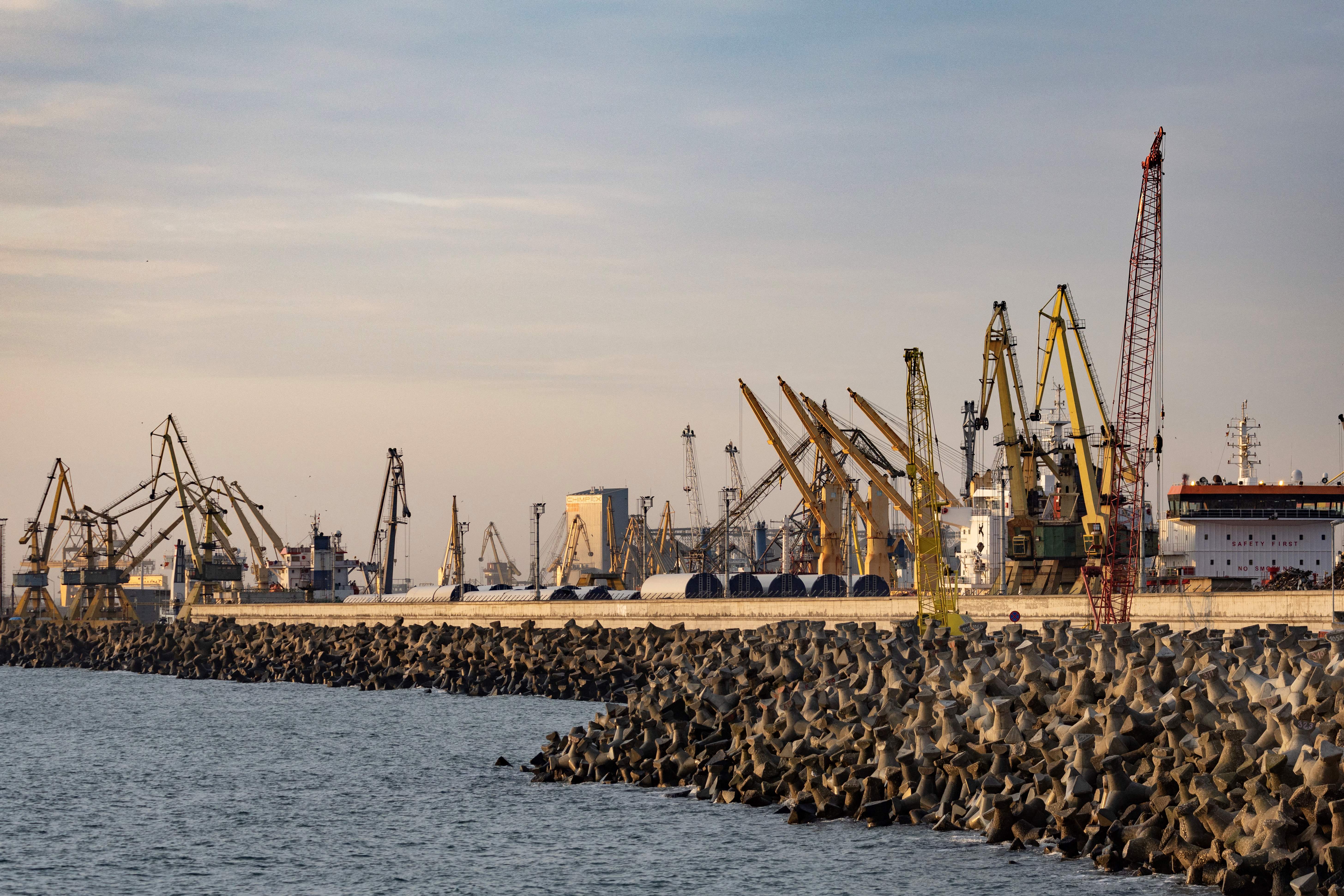 A picture taken on December 7 2022 shows cranes at Constanta's harbour. (Photo by Thomas SAMSON / AFP)