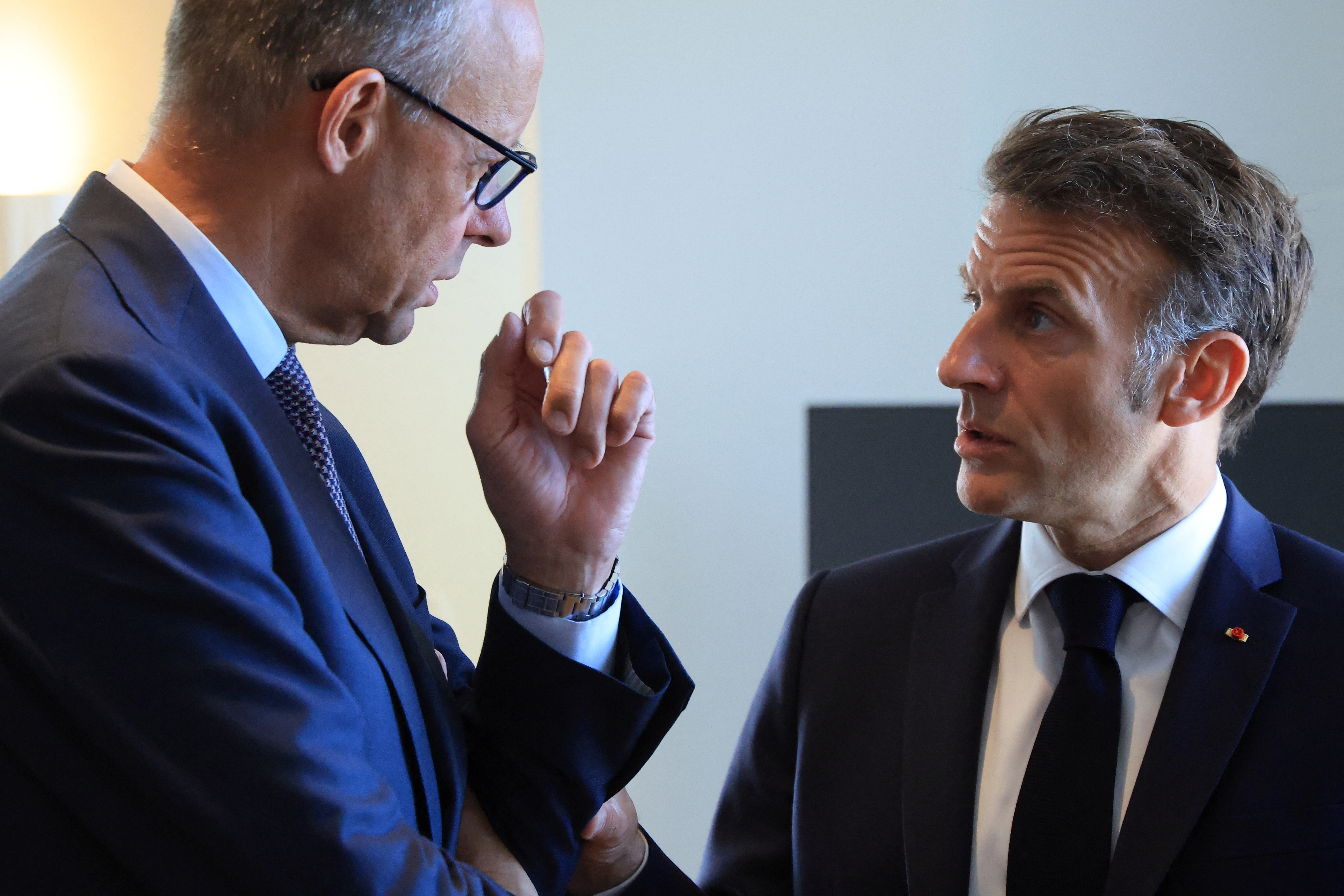 German Chancellor Friedrich Merz (L) and French President Emmanuel Macron (R) speak ahead of a meeting on the sidelines of the EU-Western Balkans Summit at Porto Montenegro in Tivat on June 5, 2026. (Photo by Ludovic MARIN / AFP)
