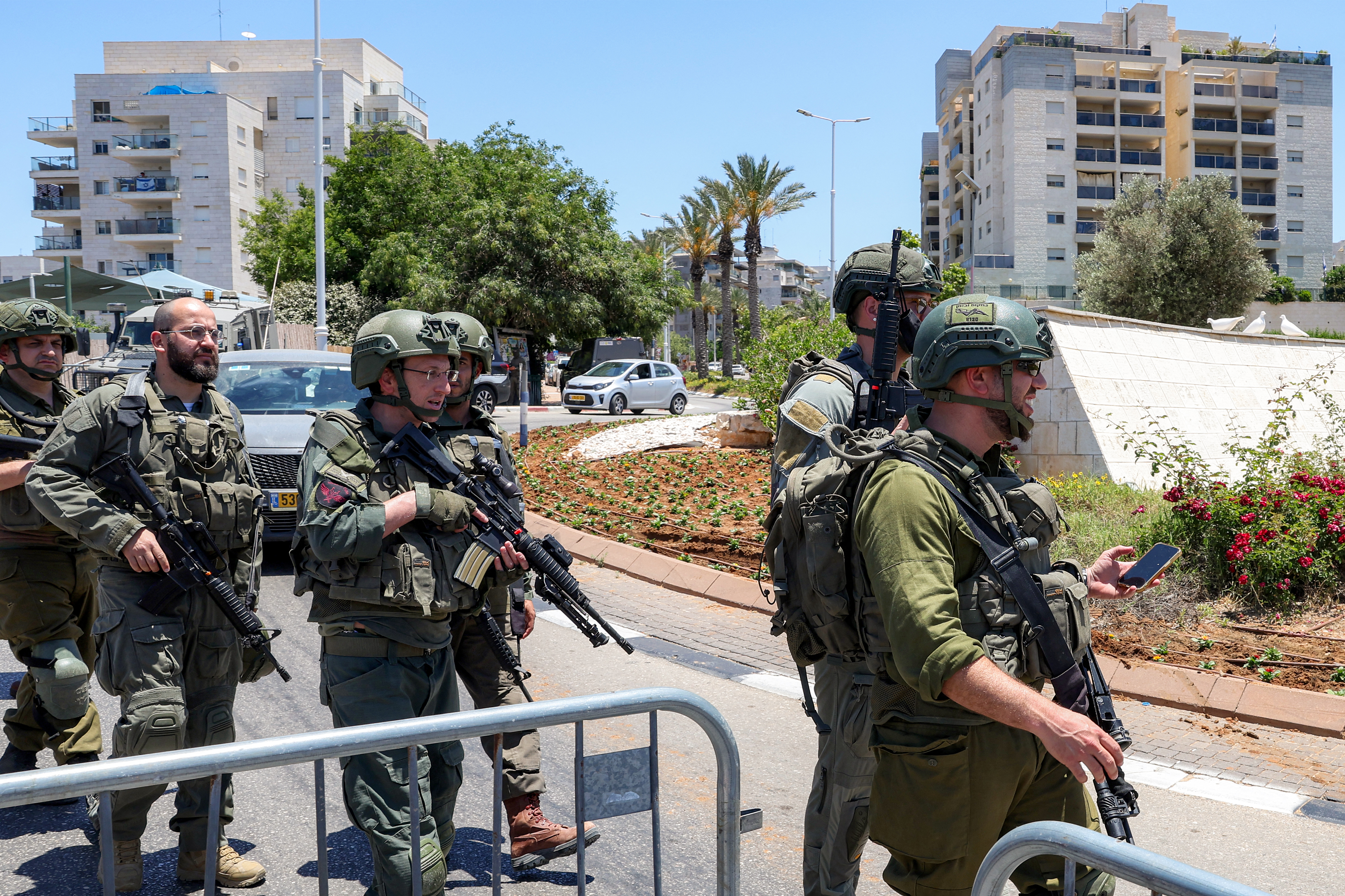 Israeli security forces gather at the site of a suspected shooting attack in the town of Tzur Yitzhak in central Israel close to the occupied West Bank on June 7, 2026.