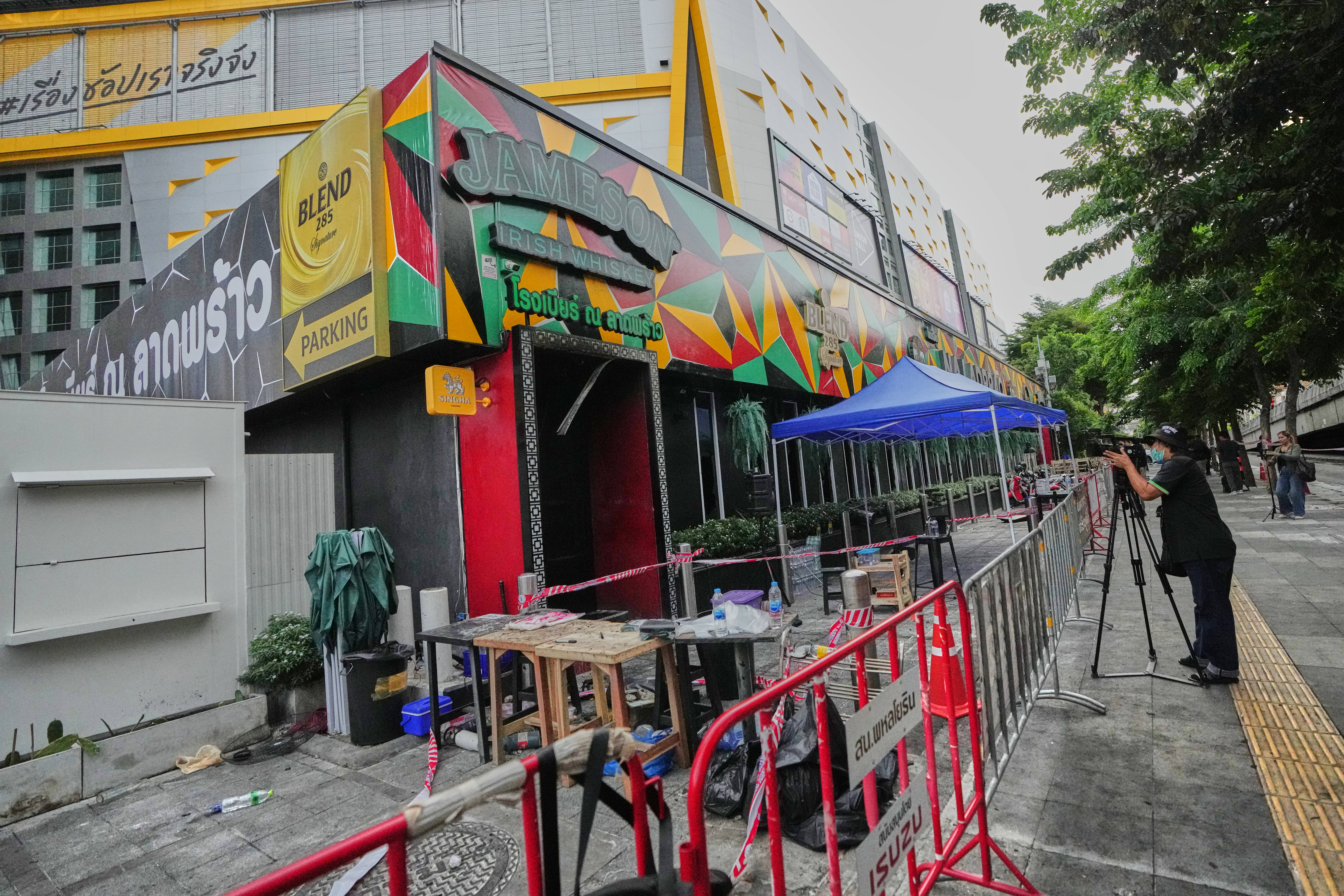 Front of a pub in Bangkok, Thailand, Monday, July 13, 2026, following a fire. (AP Photo/Sakchai Lalit)