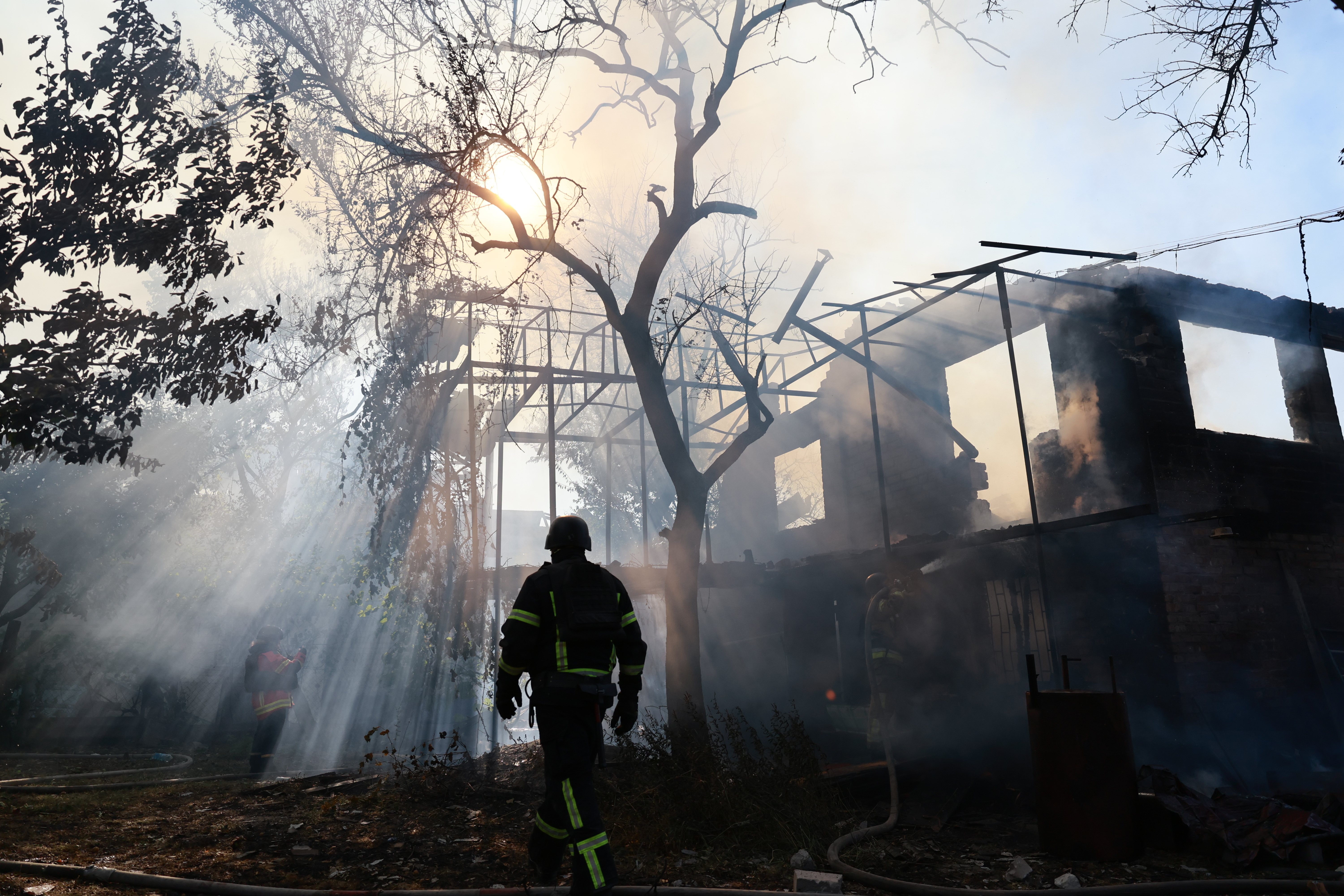 A firefighter puts out a fire after russian attack. (AP Photo/Kateryna Klochko)