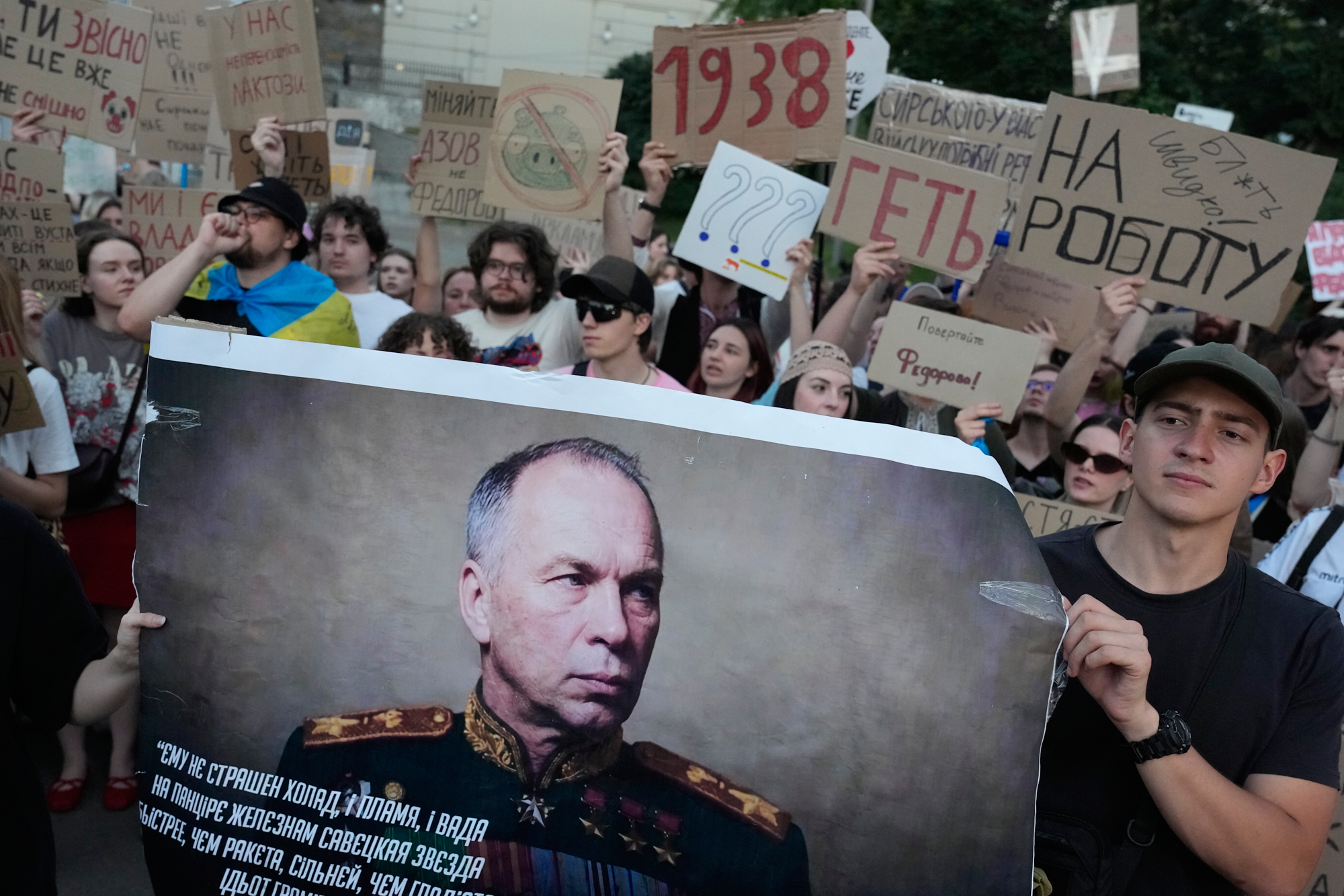 Activists hold a portrait of Ukraine's Armed Forces Commander-in-Chief Oleksandr Syrskyi. (AP Photo/Efrem Lukatsky)