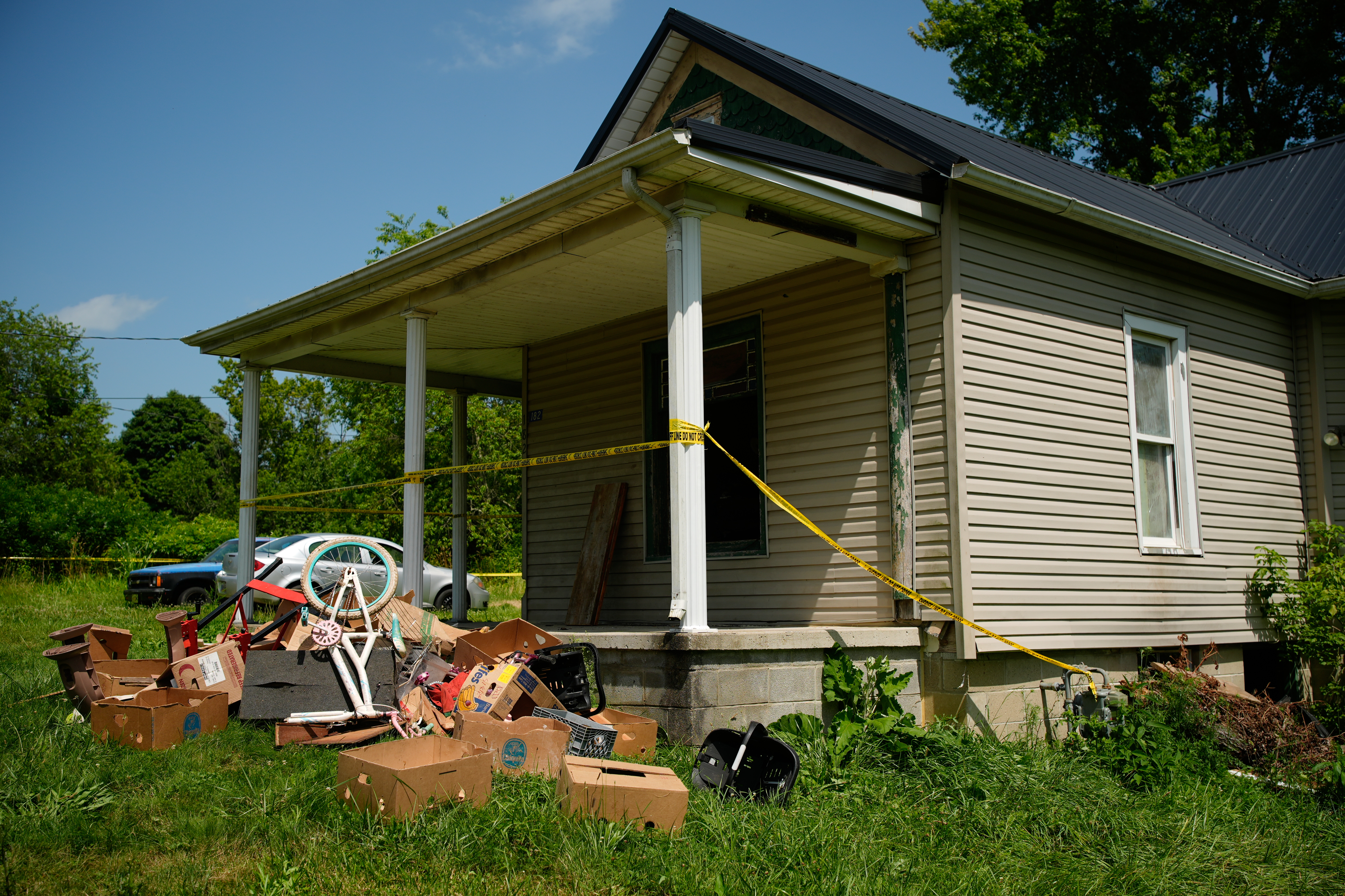 Police tape surrounds a home. (AP Photo/Carolyn Kaster)