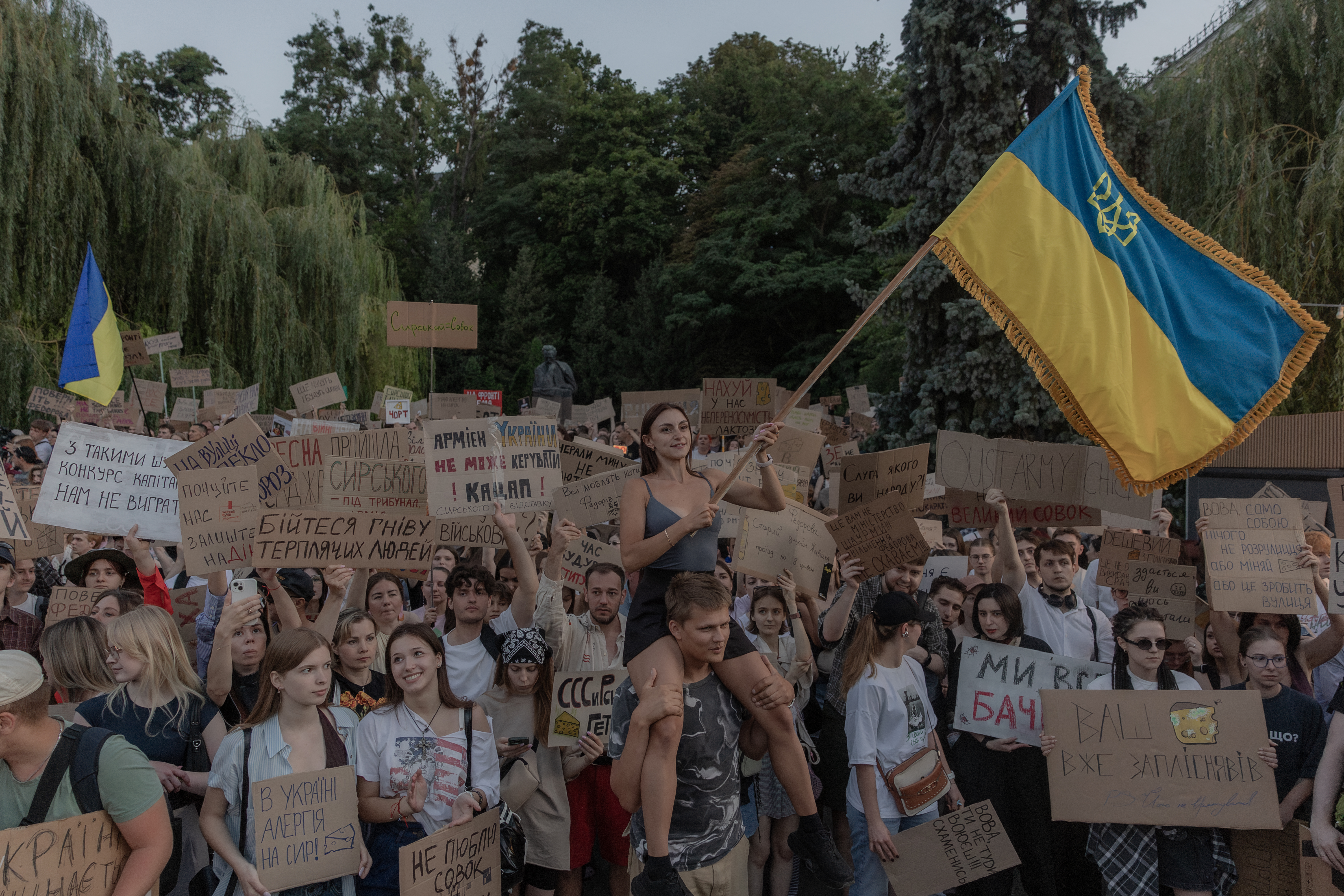 Protesters wave a Ukrainian flag. (Photo by Roman PILIPEY / AFP)