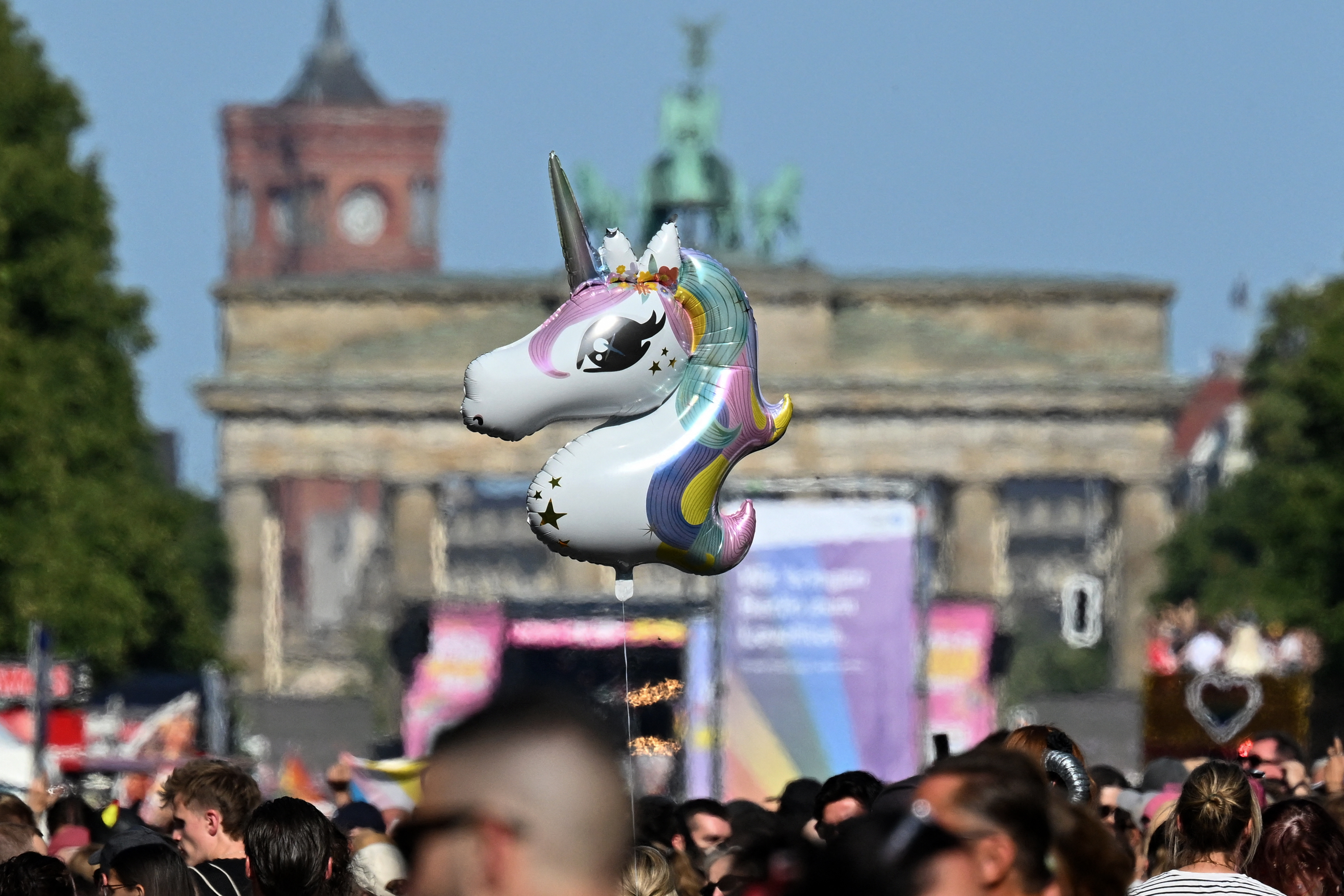 A unicorn balloon is displayed near the Brandenburg Gate during the Christopher Street Day (CSD) parade in Berlin on July 25, 2026.