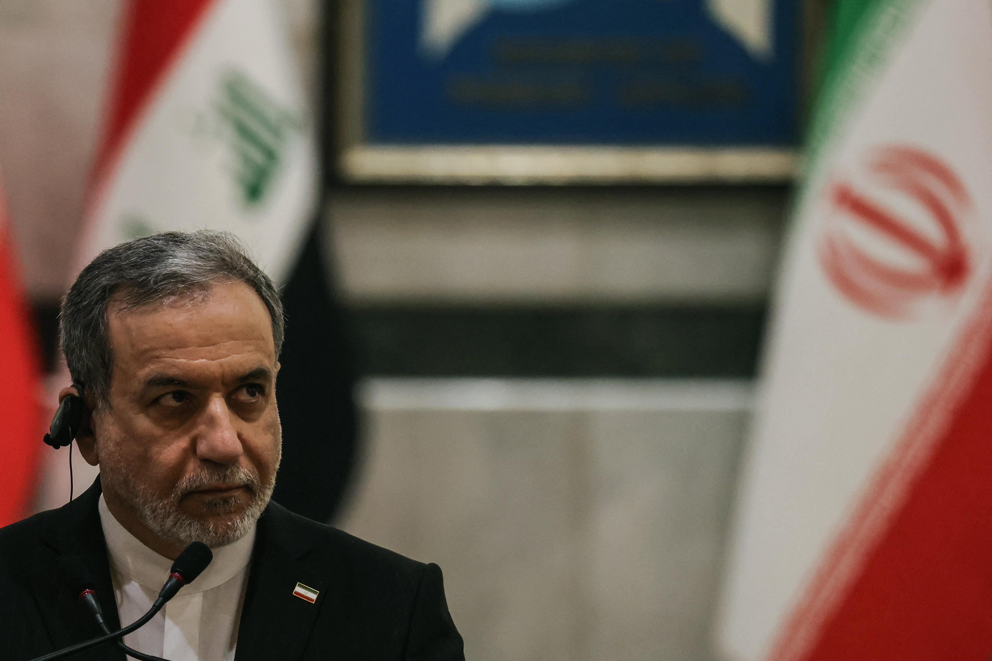 Iranian Foreign Minister Abbas Araqchi listens to Iraqi Foreign Minister as they hold a joint press conference following a meeting in Baghdad on June 28, 2026.