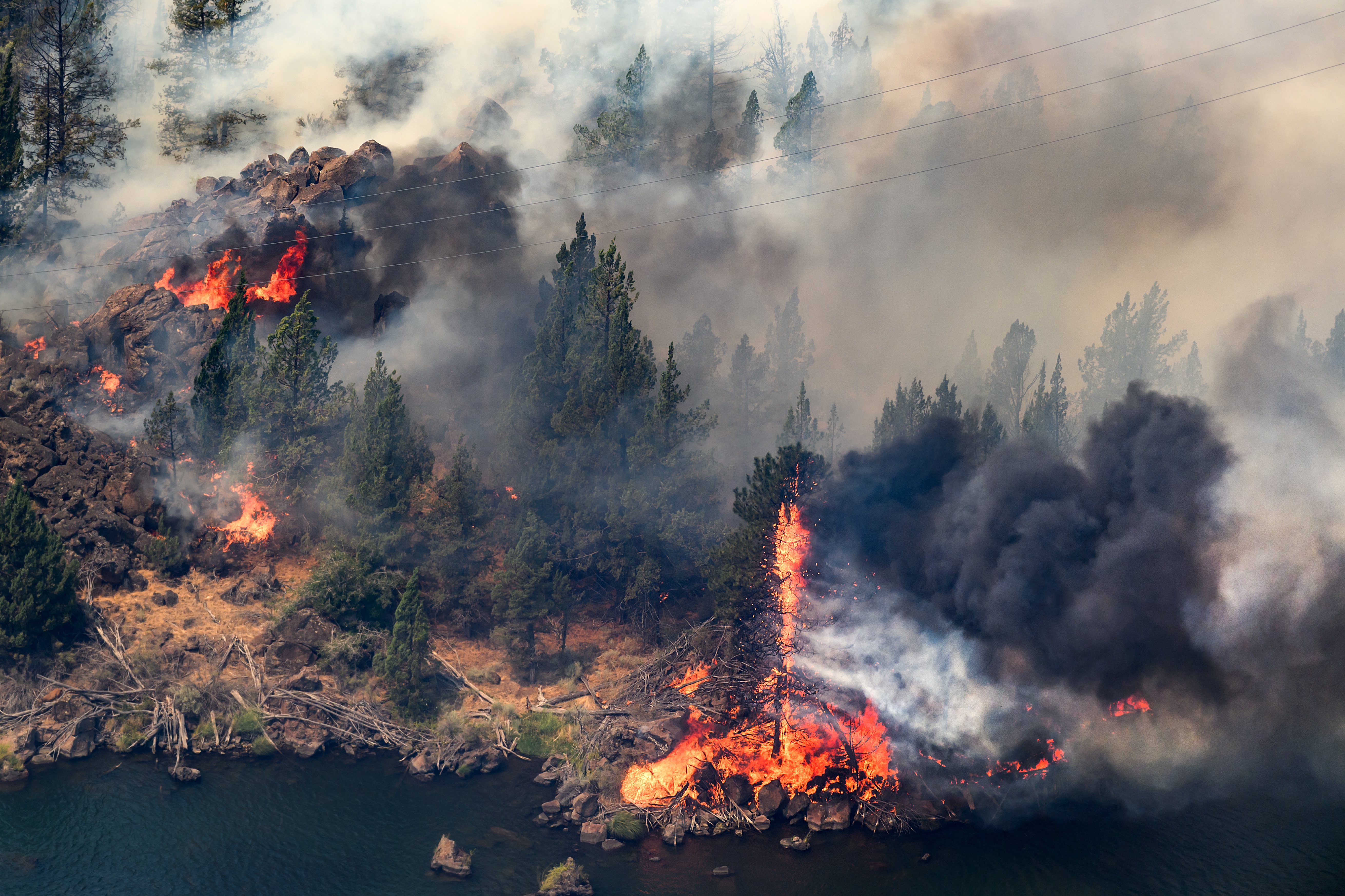 The Bench fire burns along the banks of the Deschutes River. (AP Photo/Noah Berger)